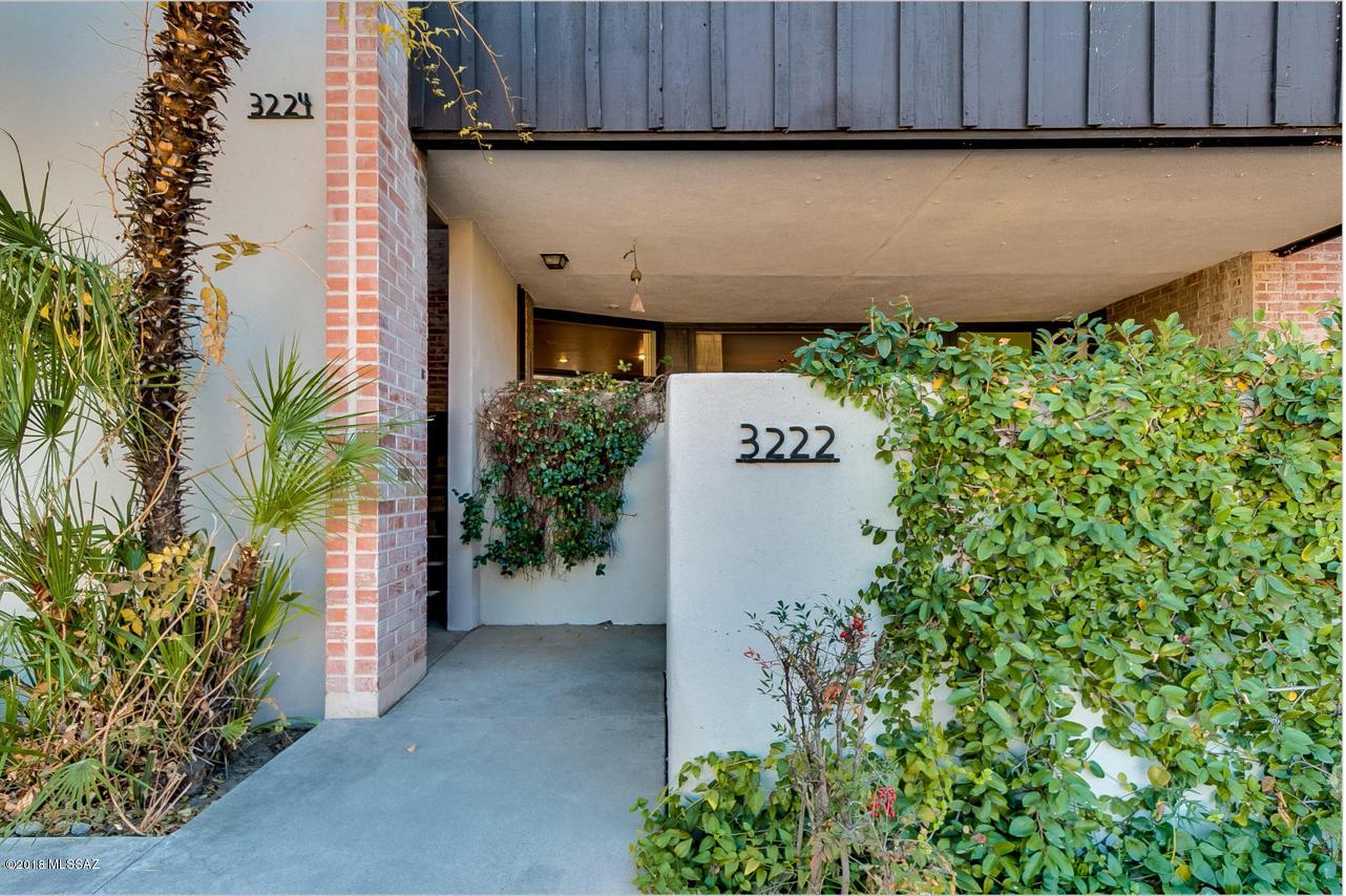 Charming spacious one bedroom condo conveniently located on the U of A bike path. Lower floor unit. Access to the large front patio from the front door and the kitchen.  Lots of cabinets, some with lighted interiors.  S.S. appliances.  Island with cooling drawers and also wet bar with sink and wine cooler.  Master bedroom has two walk in closets with built in shelves and bathroom has dressing area vanity and double sinks also a handicapped walk in bath tub/shower.  There is a half bath in the hallway.  Lovely pool and spa area maintained by the association and garbage service is also provided.  Separate one car garage with auto door opener for this unit.  Close to Loft Cinema and the U of A.