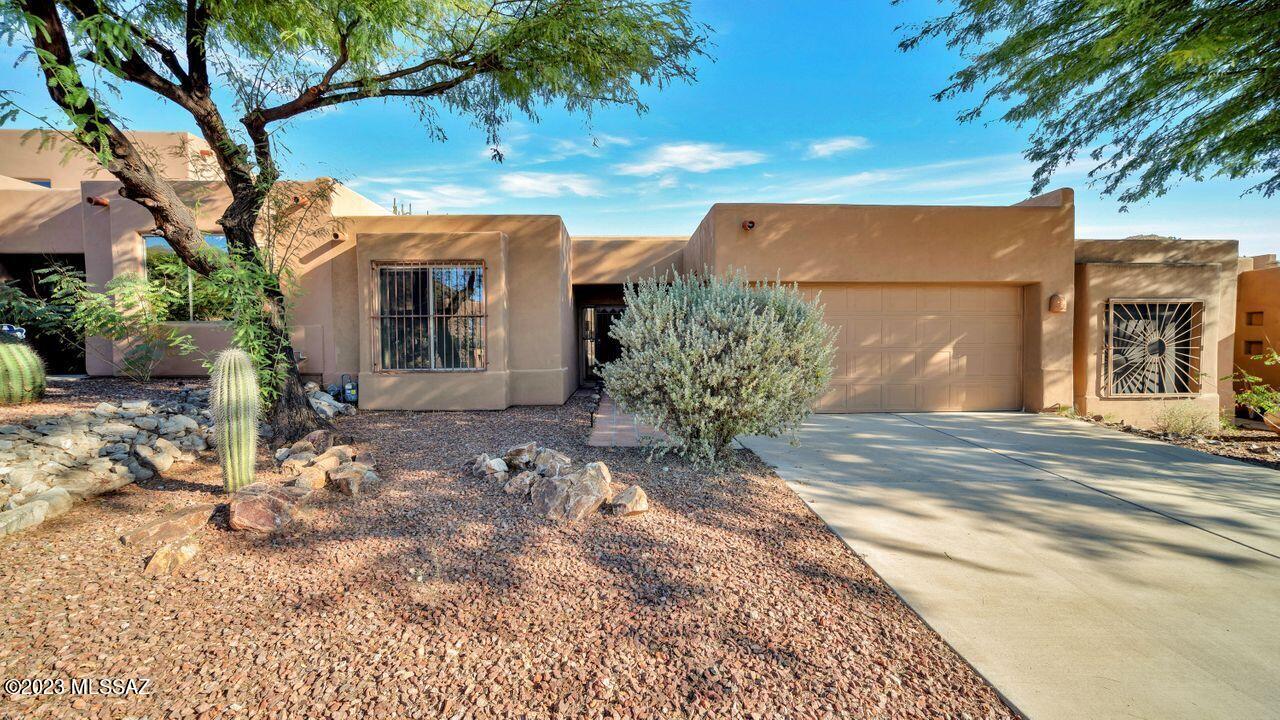 Hard to come by 2BR, 2BA Townhome in Starr Pass Golf Community. Entertaining is easy in this open concept, split bedroom home with a spacious kitchen and living room. Both bedrooms have a large walk-in closet. The guest bathroom has two doors: one accessible to the guest bedroom and another to the hallway. Cozy up by the fireplace or hang out on the covered patio and enjoy the close-up mountain views! The back patio can be accessed from the kitchen or the primary bedroom. New since June 2023: carpet throughout, interior paint, kitchen faucet, microwave, and roof recoat with a 2-year warranty. Hurry, call me for your private showing!