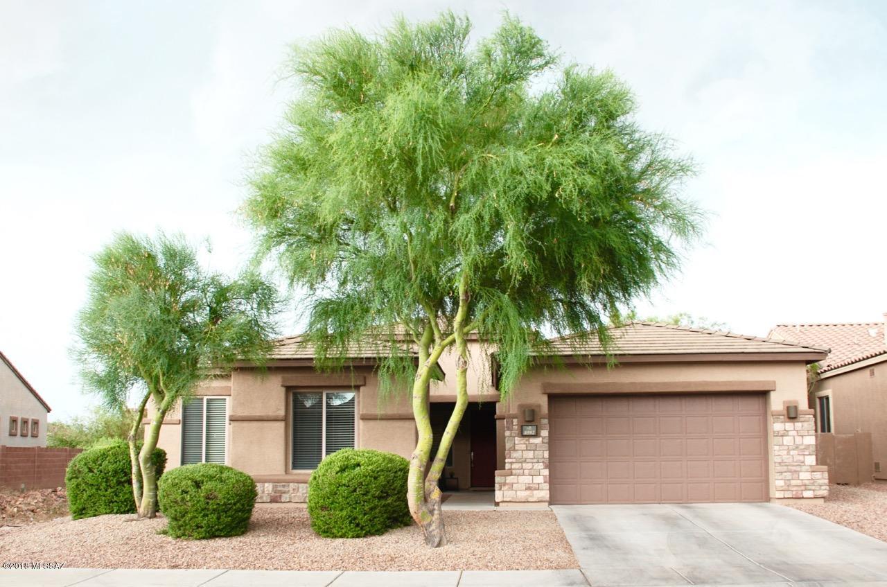 Located in the heart of Continental Reserve with views of Sombrero Peak, this spacious home has a desirable split floor plan with 4bdr, 3ba plus a den! The home's location allows for great privacy with a green belt area to the back & side yard. Only 1 neighbor! The spacious kitchen has a large island with breakfast bar, granite counters, cherry cabinets, stainless appliances & eat in dining area. Kitchen flows into the great room with recessed lighting & a cozy gas burning fireplace. For entertaining, there is a large formal dining room. The roomy mstr bedroom has a large picture window & patio access. Separate vanities in the mstr bath, with soaking tub, separate shower & huge walk in closet. Split floor plan allows privacy for everyone. Exterior of the home has been recently painted 6/18 with the popular tan color scheme.Designer touches throughout this lovely home with wall niches for art display.  Separate laundry room with additional cabinets & sink.   Back yard is great for entertaining with an extended paver patio, wrought iron "view" fencing , putting green and grassy area.
