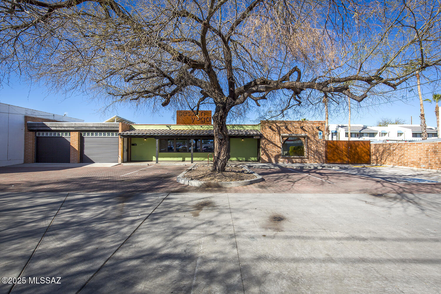 1349 SF centrally located freestanding office or retail building .   Consciously renovated interiors with abundant natural light and carefully curated finishes.  Concrete & plank flooring throughout: Reception, Office, open studio, work room, break room and 2 restrooms., 18' sliding barn door opening to tranquil fully wooden-decked, lattice covered garden patio with 8 mature trees and sweet smelling rose and jasmine vines.   Ample on-site parking and signage visible from Speedway. Secure rolling shades on exterior windows.  C-2 Zoning.