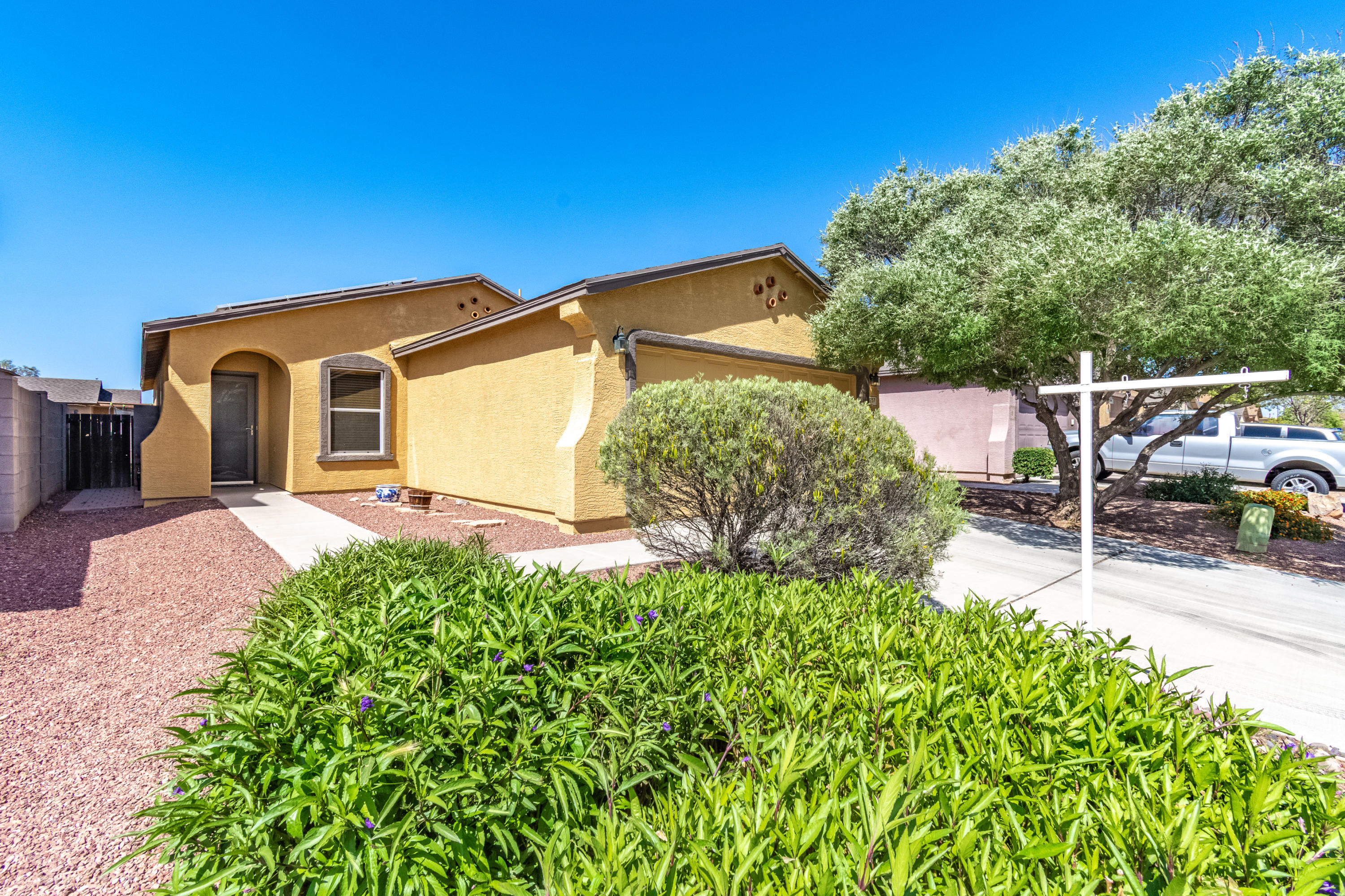 Home Sweet Home! Spacious 3bed/2bath home with den that provides an open living area.  Enjoy a forever green turfed back yard to unwind at the end of the day. Master bedroom features a walk in closet and full bath, the second bedroom also features a walk in closet. Conveniently located close to 1-10 for quick freeway access, and located within 20 minutes of downtown, Raytheon, Amazon and shopping centers. Solar panels are leased through Sunrun.
