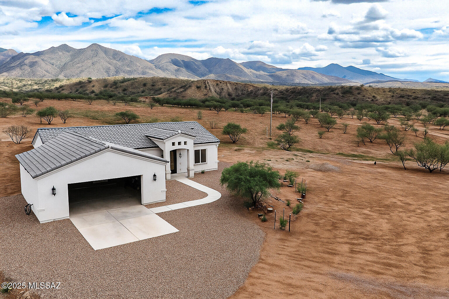 Discover this stunning new custom-built home on 36 private acres just minutes from Patagonia Lake. Thoughtfully designed with quality craftsmanship and high-end finishes throughout, this home offers both comfort and style. Soak in the breathtaking mountain views from nearly every angle, relax in the hot tub, or entertain in the private fenced yard. The oversized garage provides ample room for vehicles, storage, and recreation toys, while the land is fully fenced and ready for your animals. Whether you dream of wide-open space, outdoor adventure, or simply a private retreat, this property blends modern living with the beauty of Southern Arizona.
