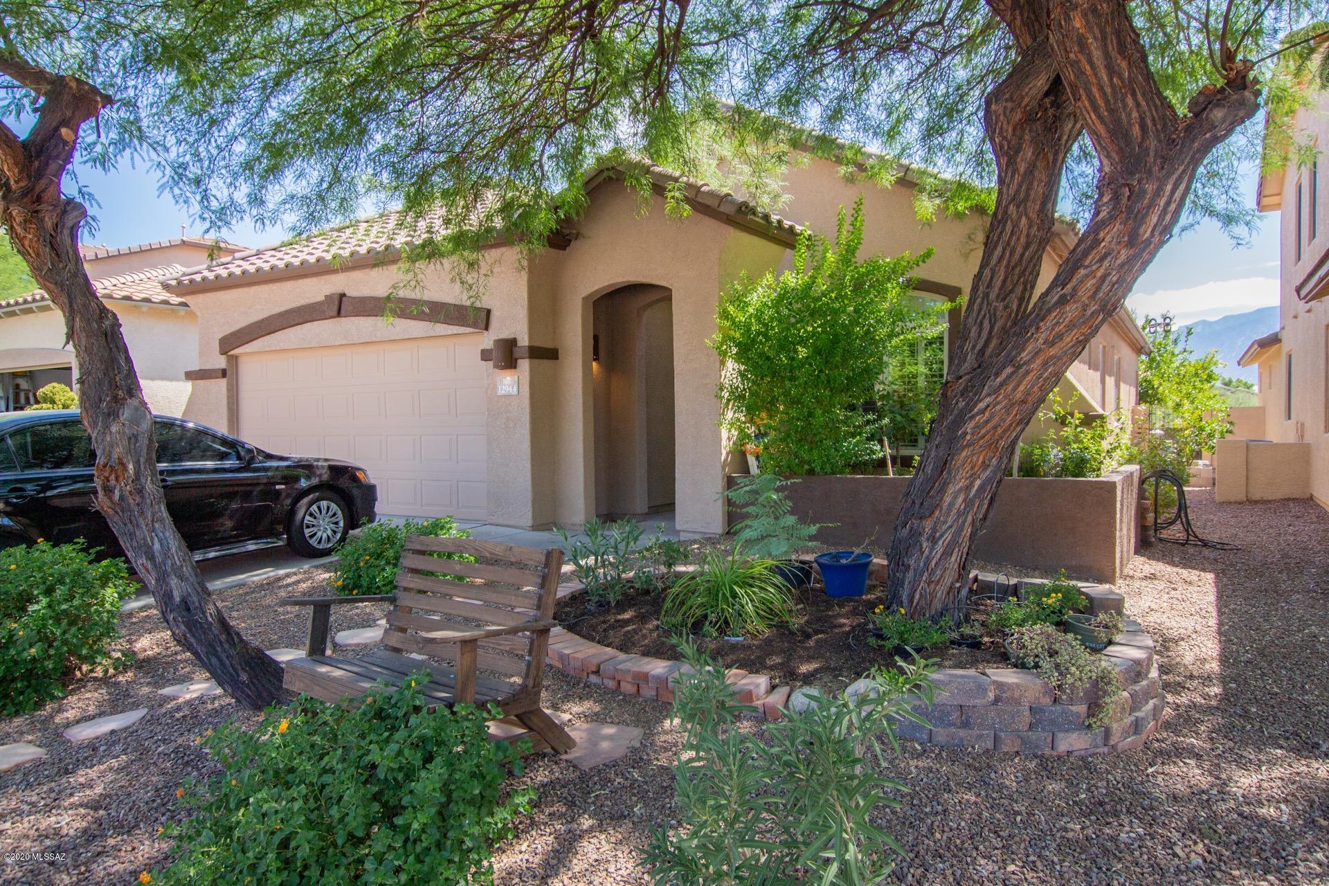Breathtaking Mountain Views! Sparkling heated plunge pool & spa, built-in BBQ, & covered paved patio. An entertainer's dream backyard setting. Stunning chef's kitchen features a plethora of cherry wood cabinetry, SS appliances, & plenty of counter space. Custom palette, plantation shutters, & fireplace for those chilly AZ evenings. 3 Generous sized bedrooms, ample closets, 2 pristine baths, & Den w/French doors.  Surround sound for your listening enjoyment. Attached garage cabinets. Do not miss out on this desert gem!