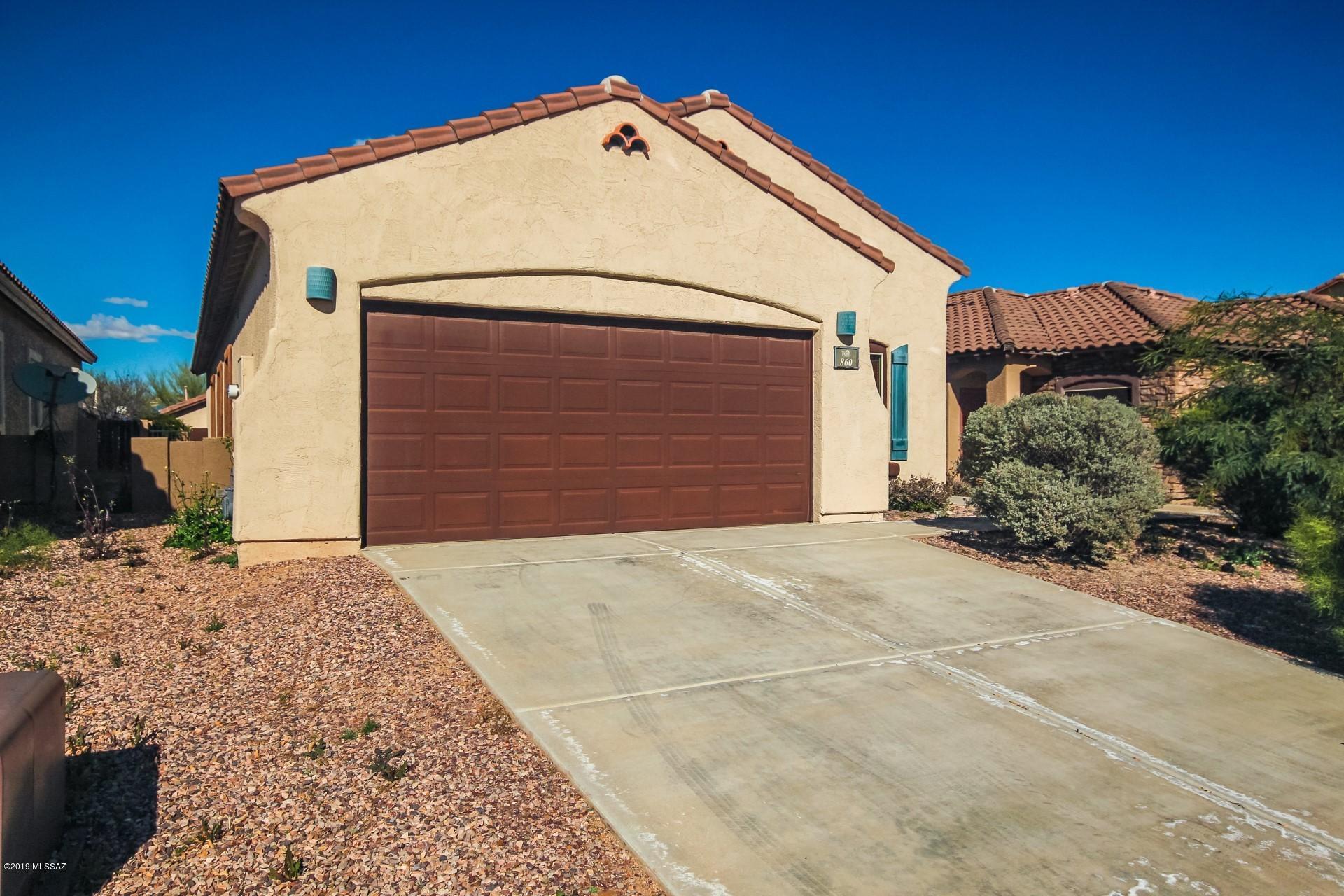 Seller will counter or accept offers between $190,000-$200,000. Charming four bedroom two bath home in the high demand neighborhood of Rancho Sahuarita!  This lovely home is located near Trio Park and is clean, vacant and move-in ready! Greeting you from the start is mature desert shrubs and trees.  Boasting a perfect kitchen complete with stainless steel appliances, rich light cabinetry and beautifully tiled flooring, this home's neutral palette will be sure to embrace your personal decor and furnishings from the start!  A dine in kitchen and additional dining area off living room provide options for entertaining friends and family!  A pantry adds the finishing touches to this kitchen.  Generously sized bedrooms and baths will be sure to offer comfort and relaxation! Enjoy an evening meal or your morning coffee out under the covered patio.  No maintenance synthetic grass and mature fruit tree completes your backyard!  Easy access to I-19 is always a plus! Call today for your private showing, this home is priced to sell and will not last!