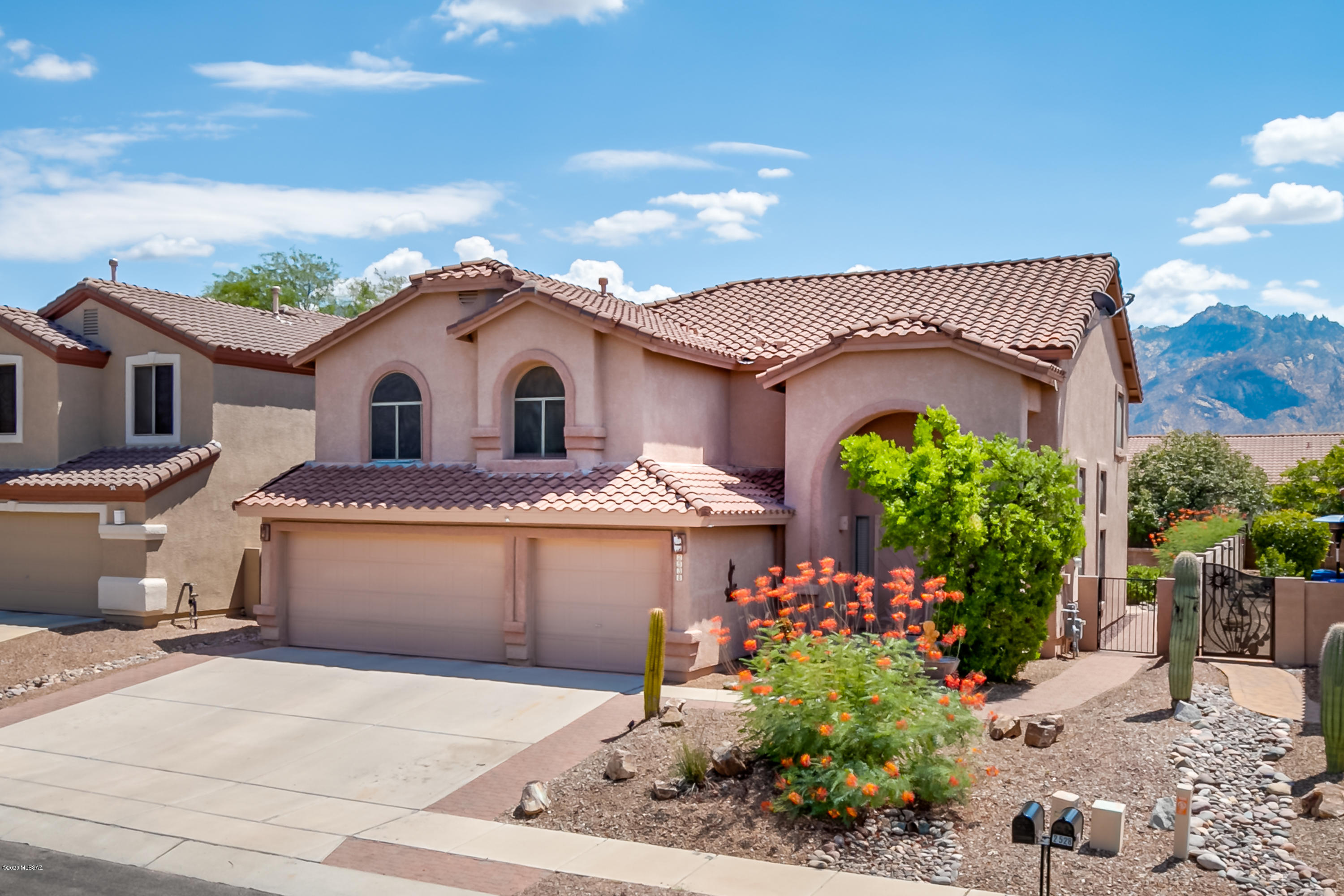 5BR/3BA 2,850sf 2-story w/Pool/Spa & 3 car garage conveniently located in Rancho Vistoso-Oro Valley. Enjoy entertaining w/east-facing backyard featuring covered patio, sparkling Pool/spa w/self-cleaning in-floor system, Kool decking & flagstone, built-in BBQ & water feature. Kitchen has ceramic plank tile, lots of cabinets & counter space, pantry, breakfast bar & eat-in area. Family room off kitchen has fireplace & ceramic plank tile. HUGE master suite has fireplace & Catalina mountain views. Formal LR/DR. Security screen doors. New carpet & paint 2020. Zoned HVAC. Neighborhood Big Wash Park features a grassy area & playground. Near Oro Valley Market place w/shopping, restaurants & theater & just a short drive to Catalina State Park & Honey Bee Canyon Park offering beautiful hiking trails.
