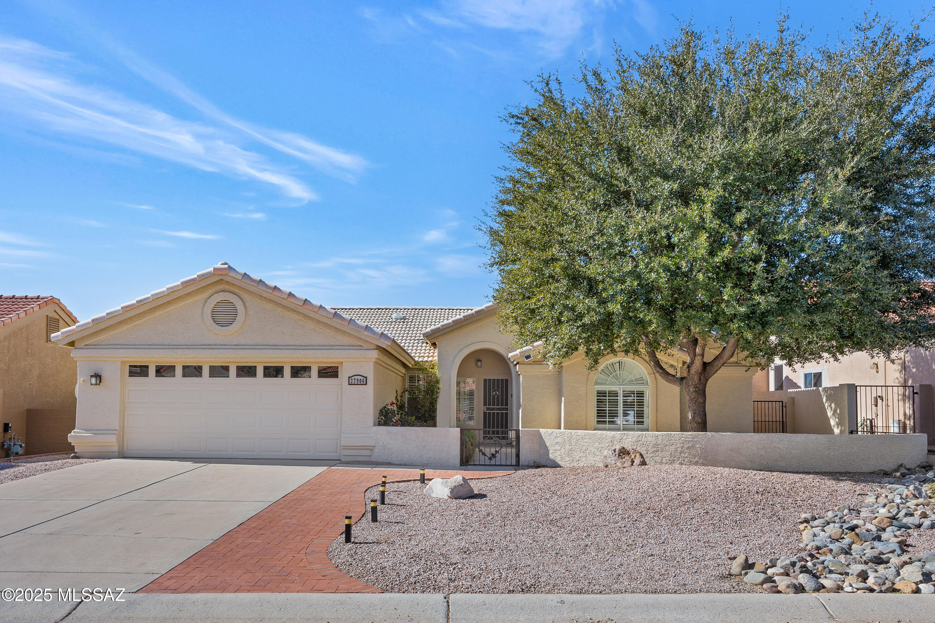 Fenced & Gated Front Courtyard with Mountain Views, Just the Place for entertaining Family & Friends in the Shade of Beautiful Oak Tree. ''Roof Underlayment Replaced 4/2025''. Spacious Dining/Living Room with Gas Fireplace with Mantle. Updated Kitchen has Granite Counters, Gas Range, Custom Cabinets & Kitchen Dining Area. Family Room has Slider to covered Back Porch and private backyard. Spacious Owner's Suite. Updated Owner's Bath, Walk-in Shower & large Closet. Guest Bedroom has Closet with Updated Bathroom with Shower nearby. Laundry Room with W/D, Sink & Storage Cabinets. Ceramic Tile Flooring & Plantation Shutters throughout. Solar Tubes to make rooms light & bright. 2 car garage & 2023 HVAC & 2024 W/H & storage cabinets.