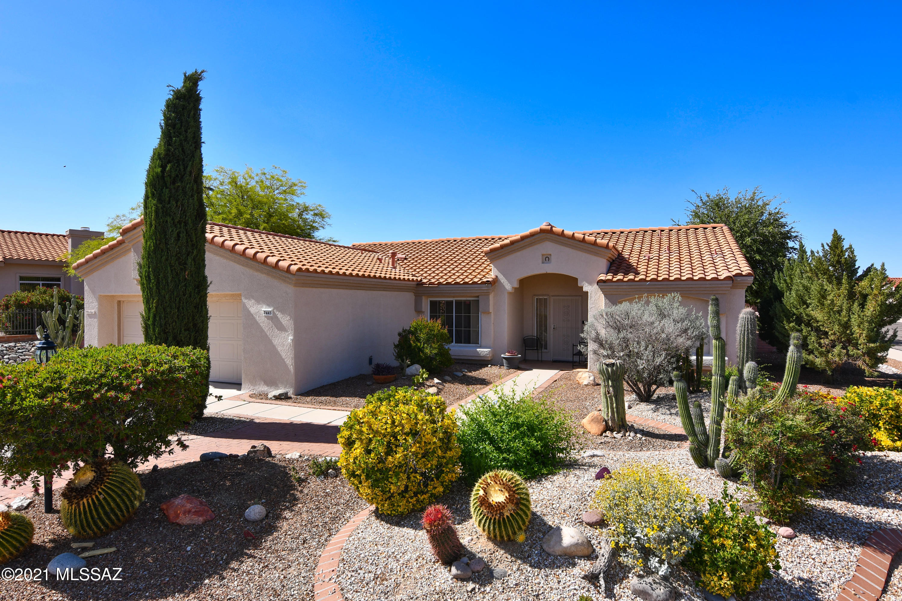 Wonderful Cottonwood Model in Sun City Oro Valley with a Lush Backyard & Catalina Mountain Views. Kitchen with Gas Range, Pantry, Center Island & Sunny Breakfast Nook. Open Living & Dining Rooms for Entertaining. Spacious Master Suite with Large Walk-in Closet. Master Bath with Natural Light from Clearstory Windows. Comfortable Guest Room with Catalina Mountain Views & Full Guest Bath. Hobby Room. Fabulous Outdoor Living Space with a Covered Porch, Large Ramada with Extended Brick Paver Patio, Saguaros, Lush Flowering Landscaping & Fenced-in Pet Friendly Yard. 2-Car Garage with Storage Cabinets. Resort Quality Community Facilities Including Pickleball, Fitness & Aquatic Centers, Recreation Center, Golf & Tennis. BRAND NEW ROOF!