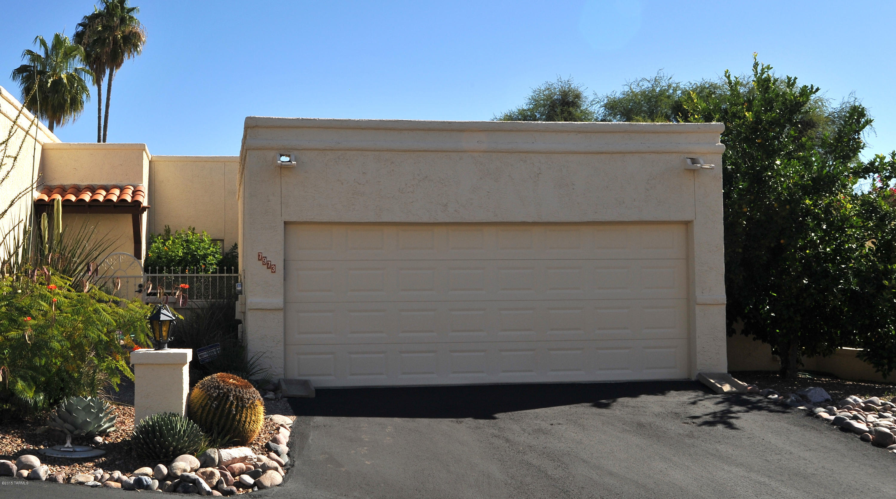 One of the best townhomes in the Sabino area!  You’ll marvel at the elegant natural Birchwood flooring throughout!  Or enjoy the unique Cyprus cabinets in the Silestone and Stainless fully updated kitchen.  Double oven for the chef!  Sit at the convenient counter bar for those conversations with the cook, or relax in the large open Great Room in front of the contemporary stone fireplace.  This fabulous home boasts all new low-e duo-pane windows and doors, executive height counters in the kitchen and baths, and California Closets in the Master Bedroom Walk In.  Home was completely rehabbed in 2008 to include new plumbing, electric, drywall, AC, water heater, etc.  Fully enclosed 2 car garage!  Backyard privacy!  Immaculate and move in ready!  And the HOA takes care of the landscaping, exterior paint, garbage collection, Rural Metro fire, PLUS the major portion of the homeowner's insurance.  Come and see for yourself!