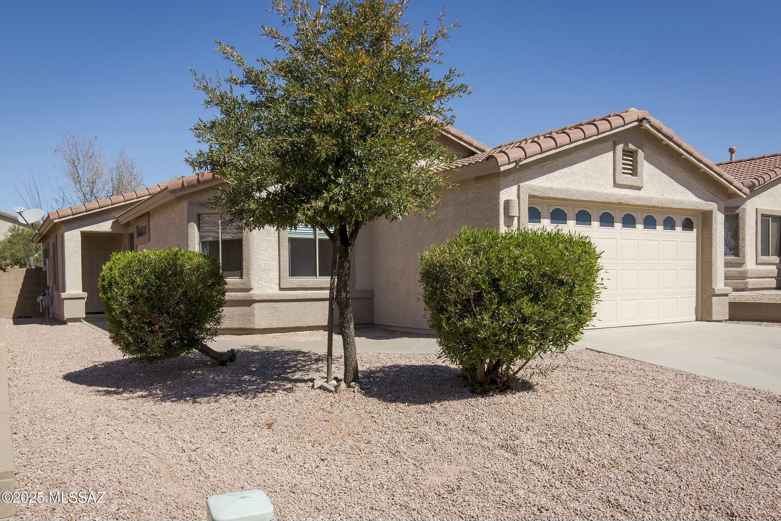 Priced very low for area & Only steps from Tortolita Preserve, 2400 acres of gorgeous desert! Seller will look at all offers!Beautiful 4 bd home in desirable Villages Subdivision of Dove Mountain! Split floor plan, Vaulted ceilings, Open concept, Bright natural light. Large Great Room with Solid Tile and Plank Flooring. Kitchen includes SS appliances, upgraded cabinets and Quartz counters, and includes area for dining table. Primary bedroom w/new Granite Counters double vanity, separate garden tub/shower, toilet room and walk-in closet. Office/4th bedroom located off Great rm. Community park includes large grass area, dog parks, tennis courts, basketball, volleyball,multiple Ramadas,BBQs. Very convenient location, close to I-10, grocery stores, schools, restaurants, businesses & shopping!