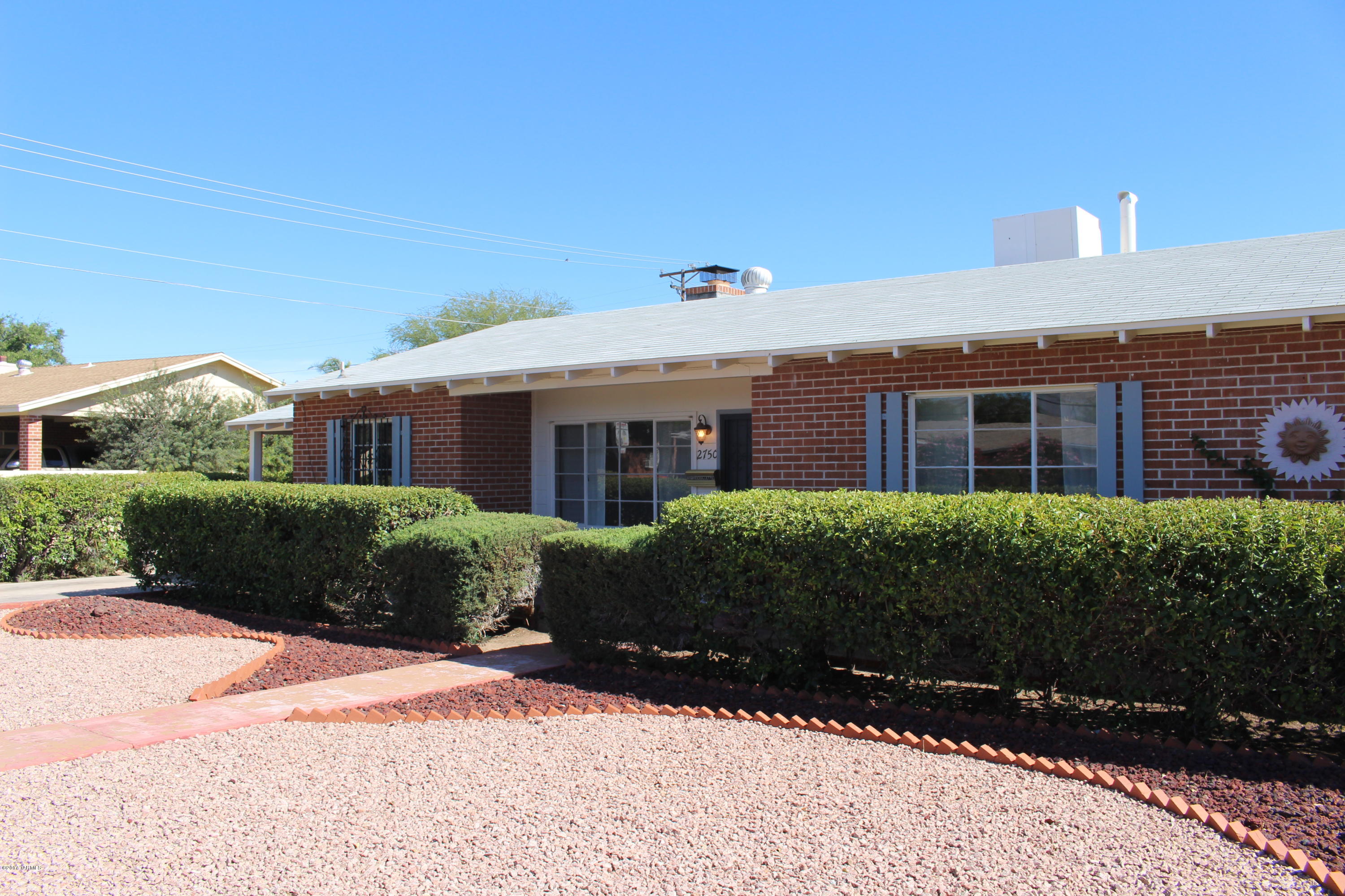Lovely, lovely, lovely!! This gorgeous Broadmoor home is spacious & absolutely positively lovingly maintained. This home has been in the same family for decades & incredibly well cared for! Recent upgrades include brand new stainless steel appliances, granite countertops, flooring throughout & freshly painted. All of the bedrooms are sizable & have ample storage. Large Arizona Room could be an office, rec room, studio, etc! Vintage tile in the bathrooms, both of which are totally delightful! Large yard plus the HUGE & highly functional  workshop/garage/studio/storage space in back yard! A rare find in midtown. BikeScore of 96 & WalkScore of 76! Walk to Barrio Bread, Cashew Cow, Bisbee Breakfast Club, Falora, etc. There is nothing to do here but move on in. Act fast as this will not last!