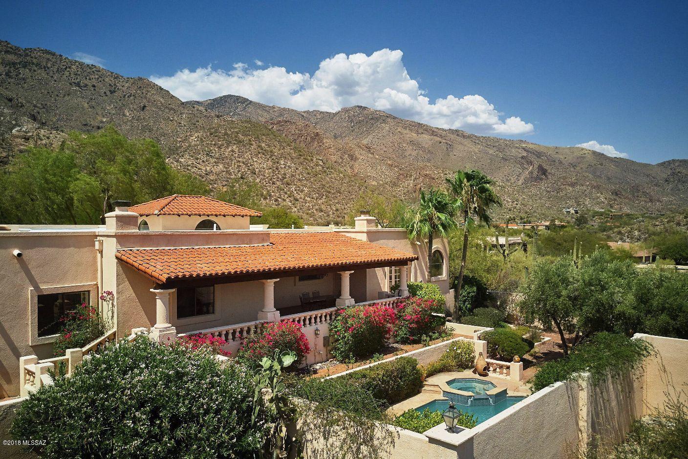 Finisterra in the foothills, custom built home with chef's kitchen, large family room with fireplace. 5 bedrooms. 3.5 baths, formal living room, formal dining room. city and mountain views. immaculate throughout