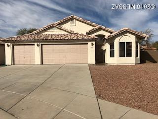 Beautiful, clean, well maintained home on premium large corner lot.  The inside is a must see, open floor plan design.  Granite countertops, cherry wood cabinets, breakfast nook in kitchen area.  Master suite has plentiful area,  walk in closet with new bath and fixtures.    Gas Fireplace in living area.  New led light fixtures.  Finished 3 car garage.  Landscaping is low maintenance, large enough for a pool.  New paint inside and outside. Close to U of A and Pima CC West, shipping and amenities close by.