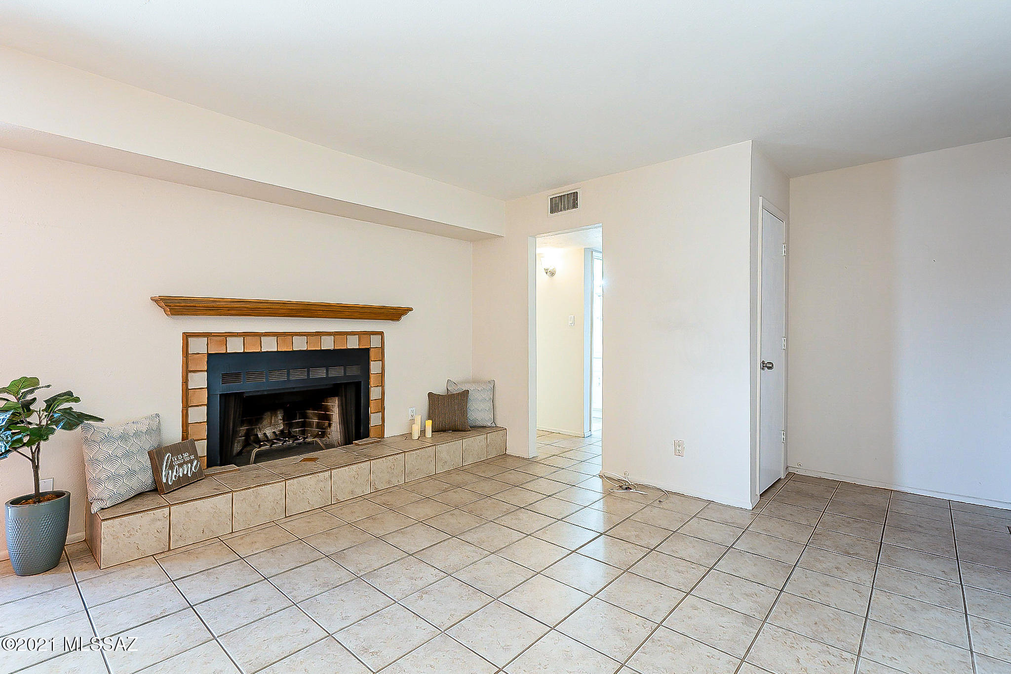 This 2 bedroom upstairs condo with jack-and-jill bathroom is cute as can be and move-in ready! Conveniently located in lush and wonderfully maintained Las Colinas, the condo features neutral tile flooring throughout living areas, hall, and bathrooms; cozy wood-burning fireplace with mantel; galley kitchen with white cabinets and tile countertops/backsplash opening to roomy dining area; tiled tub/shower surround; spacious bedrooms with newer carpet; and lots of closet space. Sunset views can be enjoyed from the large covered balcony with access from the dining area and one of the bedrooms. Las Colinas offers 2 swimming pools and 3 laundry rooms. The HOA provides water, hot water, sewer, trash removal, roof maintenance, exterior building maintenance, termite treatment, and landscaping.