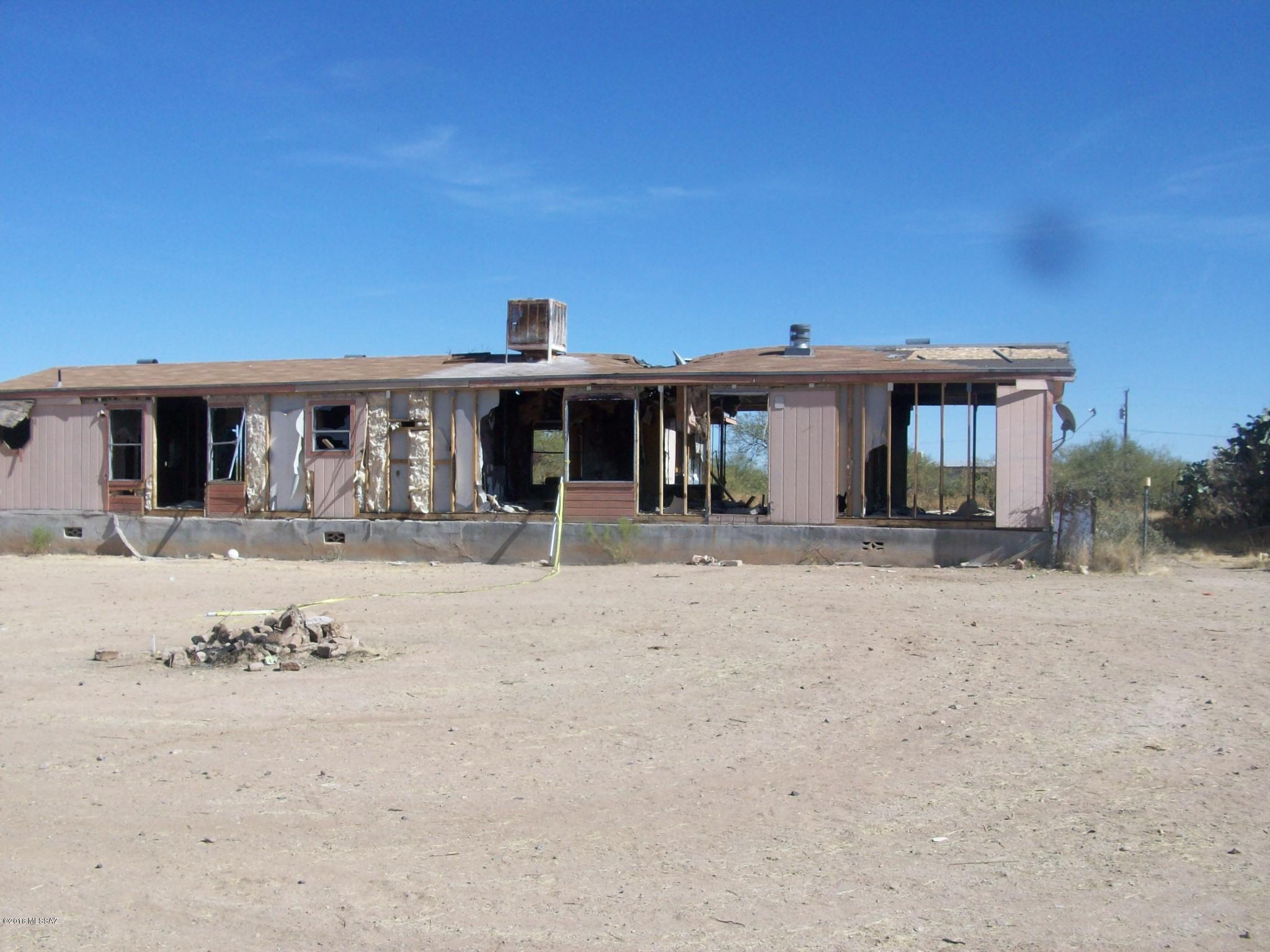 Slightly over an acre - water, septic, electric stand - affixed Manufactured Home is damaged and vandalized - great lot for a new home.  Priced right for the utilities and location.
