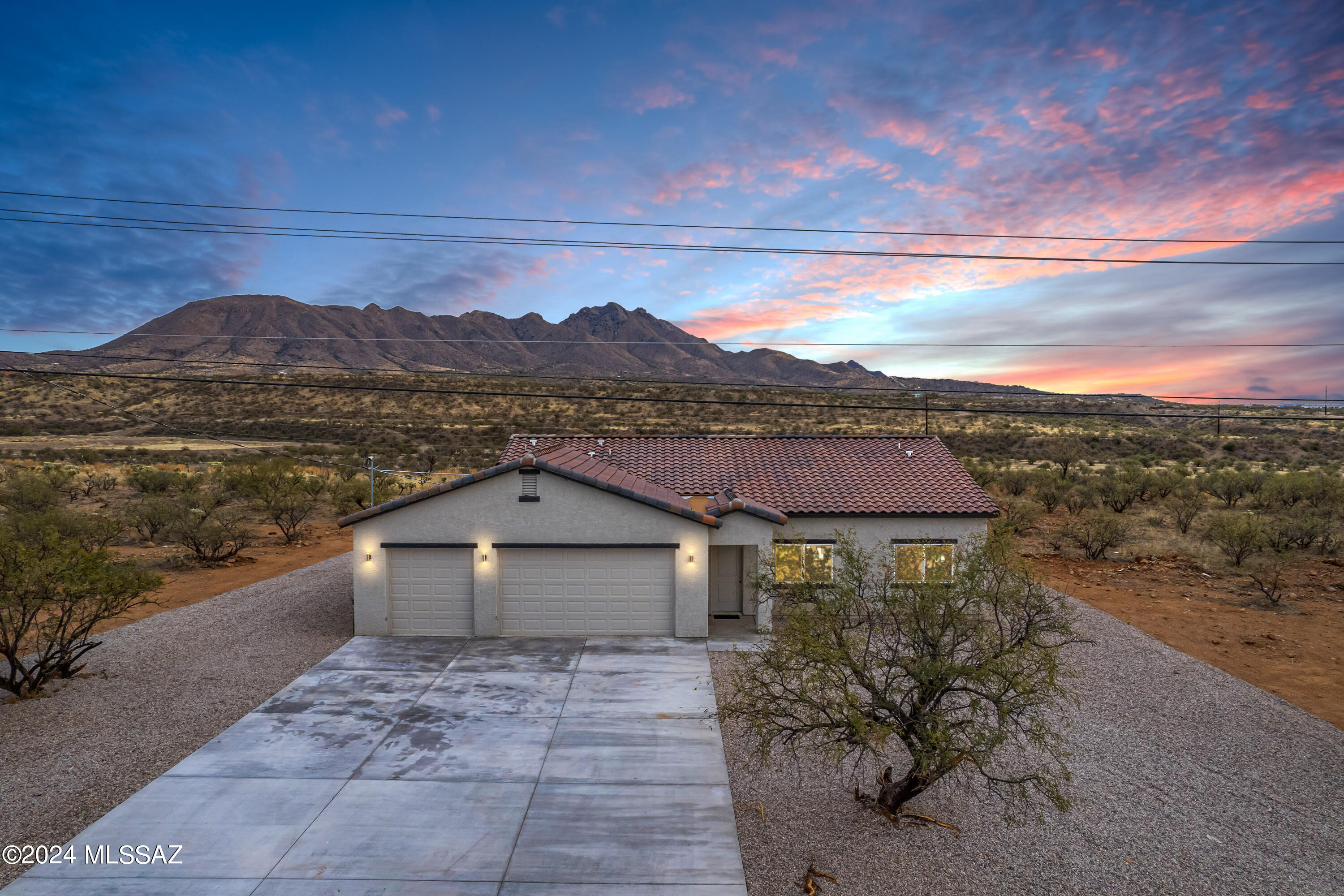 Stunning new build home located in the serene mountains of Rio Rico AZ. Featuring 3 bed, 2 full bath, laundry room, and an open floor plan with 10 ft high ceilings that create a spacious and inviting atmosphere. The three- car garage is a great feature for car enthusiasts or extra storage. This home offers a dream custom kitchen with granite countertops adding a touch of elegance and durability, while the breakfast bar area provides a cozy spot for enjoying meals or chatting with friends. With No HOA, the huge backyard is like a blank canvas, giving you the freedom and endless possibilities to create your own oasis with breathtaking views of a desert landscape.

Ask about 0% down options. 

Call agent for more details.