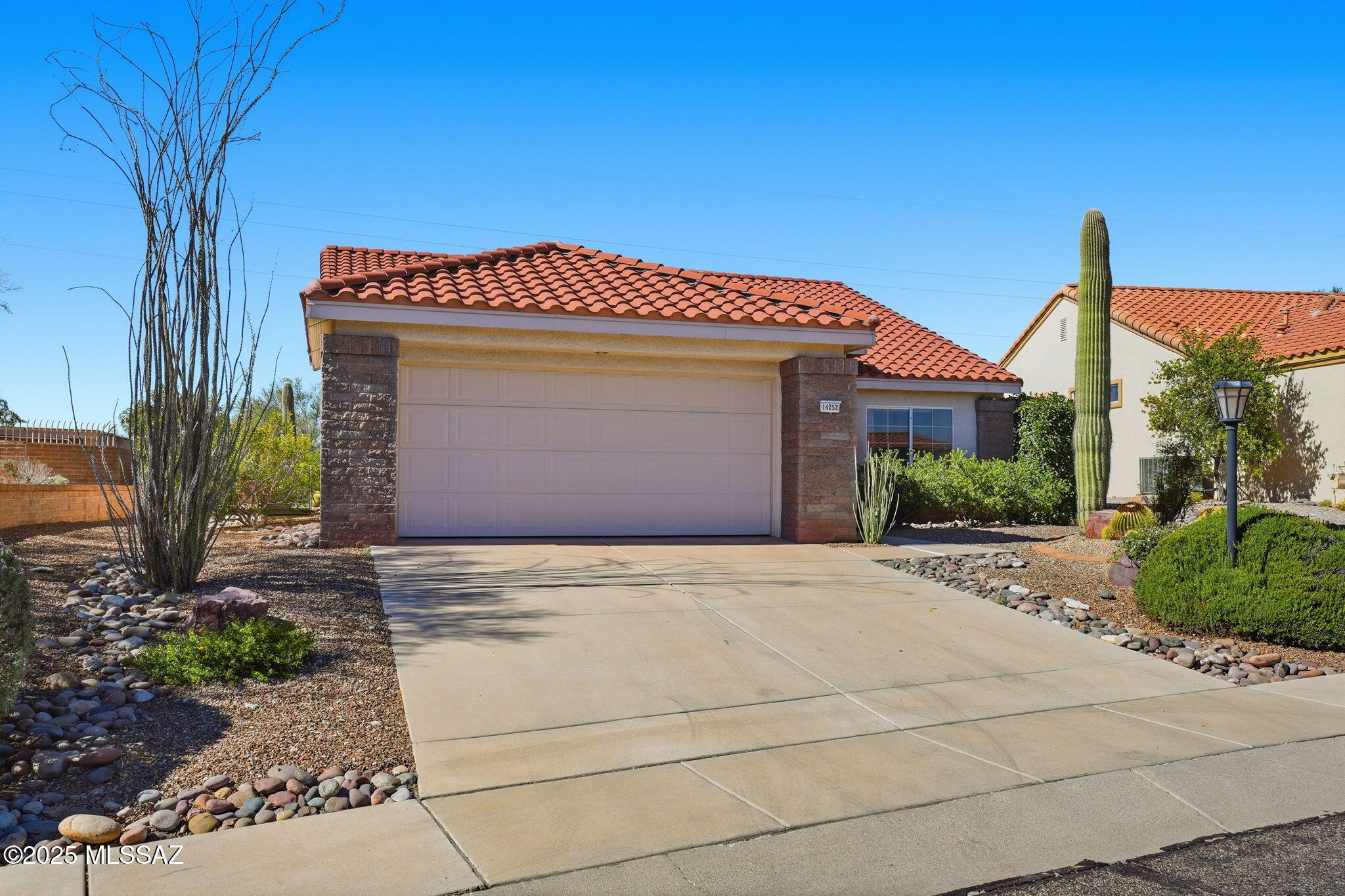 Welcome to this popular 2BD/2BA, 1,371 sq ft. Claridge model nestled in the sought-after Sun City Oro Valley 55+ active adult community. Step inside to an inviting open-concept floor plan that's perfect for entertaining or relaxing. The chef's kitchen flows seamlessly into the great room, creating a warm, welcoming space for gatherings. The spacious owner's suite offers private patio access, an ensuite bath with dual vanities, a walk-in shower, and a generous walk-in closet. The split floor plan ensures extra privacy for guests. Enjoy beautifully landscaped front and back yards, complete with an extended covered patio a perfect spot to unwind. Experience the best of desert living and all the amenities Sun City Oro Valley has to offer, including golf, pickleball, dining and more!