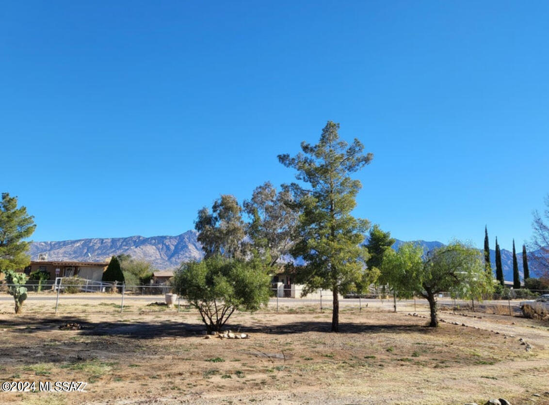 Nearly half an acre fully fenced, zoned GR-1 is now available in Catalina, AZ. This parcel offers spectacular mountain views and is flat and usable. All utilities, including the septic system, are on-site. The property includes a storage shed, a large carport, and a potential workshop building. This versatile property presents many possibilities, so bring your ideas!