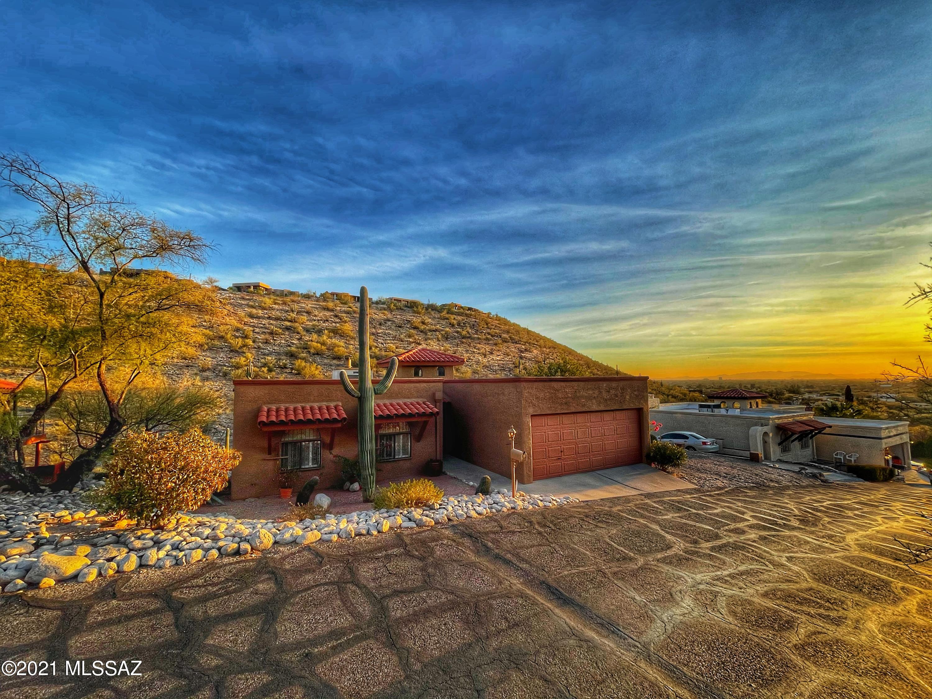 Looking for Income potential? A home and office combined? Come see this gorgeous 2 level home nestled in the Sabino Canyon Ridge. This 3,000+ Square foot oasis in the desert is perfect for relaxing and enjoying your beautiful view of the Tucson Sunrises and Sunsets. This Gem of a home is split into 2 separate living spaces with a 3 bed 2 bath living space upstairs with a full kitchen and a master bath with Garden Tub, great for relaxing after a long day at the office. Downstairs there is 1500 sq ft 2 bedroom, 1 bathroom with a den,  complete with a Kitchenette that includes a refrigerator and Microwave. Both sections of this home have their own entrances and have zoned heating and cooling. Downstairs is perfect for a home business, which this was actually used for  for over 25years with its own off street parking!! Do not have a home business, this down stairs suite could be used as a very lucrative income rental. Not looking to rent, then it's perfect for an older child or College Student. Either way it is a great enjoyable space. Schedule your showing today because you won't want to miss this home!!!
Updates Completed on the Property: Roof Strengthened and resurfaced in 2016, New PVC Drip Irrigation system installed in 2015, New Furnace & AC installed in the Downstairs Unit in 2018 & Exterior of Home was painted in Jan 2018.