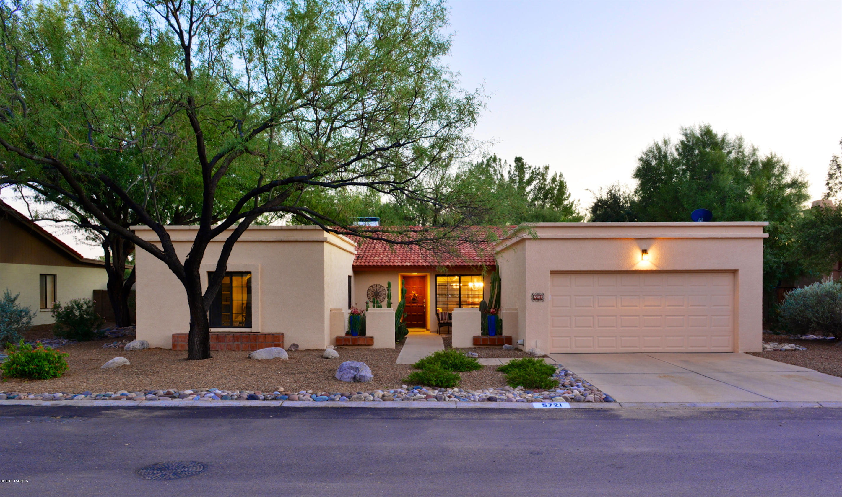 Located on one of the largest lots in the neighborhood affording abundant privacy in the huge yard with mature shade trees, grapefruit, lemon, and orange trees, covered patio, sparkling pool, and expansive deck space.  The pool has recently been resurfaced with stone-scape finish and a new pump, filter and heater have been installed.  The interior has been completely remodeled and shows like a brand new home with granite countertops, stainless appliances, upgraded cabinets, all new flooring, all new duct work, new irrigation system and timer, soaring ceilings, an open floor plan, and all new paint.  Two side yards and an attached storage room add to the value of this 4 bedroom home in the Catalina Foothills School District.