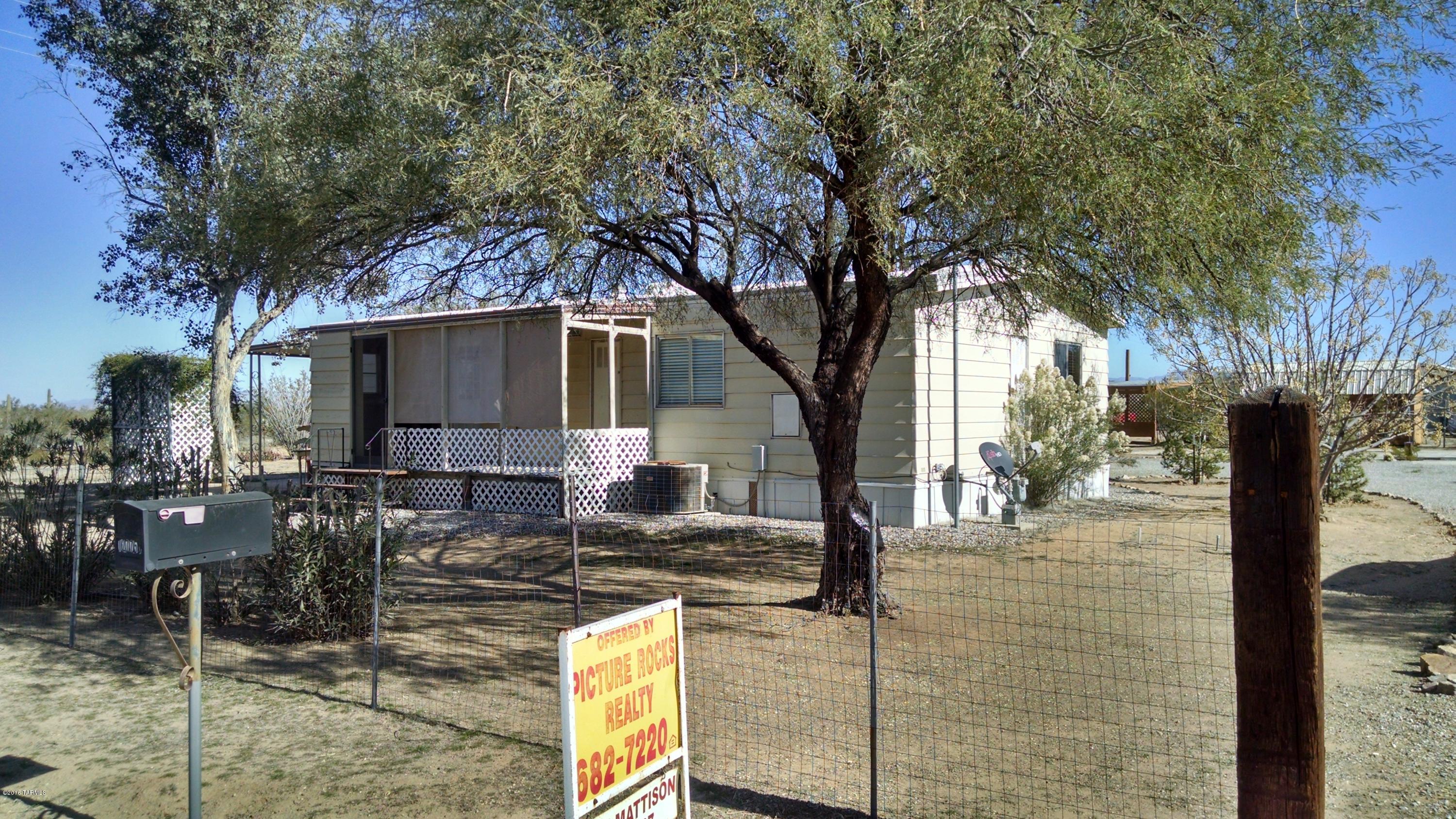 Cozy two bedroom, two bath. Well maintained, clean, upgraded, and move in ready. The entire property is fenced, and has a full RV hookup. Variety of mature trees, and drip system. Two car carport, covered porches, and gorgeous views.