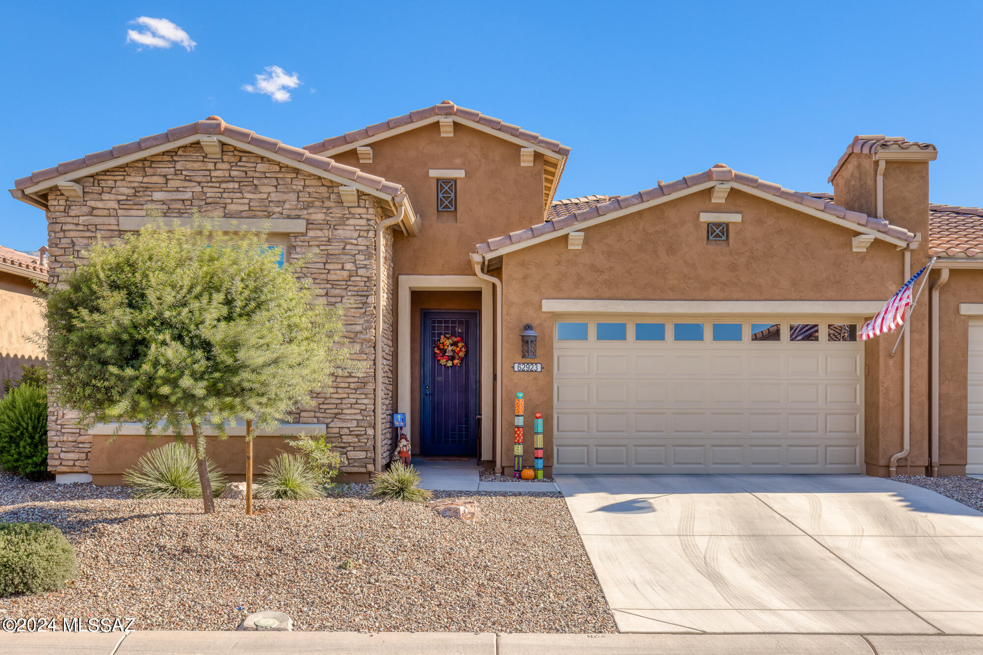 Carefree living is yours in this luxurious LAGO villa with breathtaking mountain views & numerous upgrades. Largest of the highly sought-after Unit 50 villas, this 2019-built split 2BR/2 BA + Den is ideally sited to enjoy mountain views from every back facing window. Open floor plan creates a seamless flow between the living, dining, and kitchen areas, perfect for both entertaining and everyday living.  Soaring great room ceiling enhanced with wood beams overlooks gourmet kitchen w/huge center island with ample bar seating, Arctic white Shaker cabinetry w/pullouts and beautiful Summerhill by Cambria quartz counters, . Wood plank tile throughout with carpet in bedrooms. Spacious den with custom cherry wood double barn doors w.frosted lite panels - perfect for home office, library or studio Very private owner's suite with barn-door separating bedroom and spa-like bathroom with fabulous curbless shower, linen & walk-in closets. executive height dual sink vanity with quartz counters & contemporary hardware & fixtures, Guest Bedroom is conveniently adjacent to beautiful hall bath with tub/shower in an area conducive for cohabitation quarters. Providing indoor/outdoor entertaining the extended paver patio is accessed from a great room slider and primary bedroom French door. Generous garage with plentiful storage, soft water loop and overhead storage. Villa association maintains the roof, exterior structure, pest control, irrigation & landscaping, making this an easy living 'lock & leave' home. With nothing to do but move in and enjoy, this Villa offers an excellent option that is truly low maintenance and a dream come true! HOA maintains the roof, exterior of the structure, exterior pest control and all irrigation and landscaping, making this a "lock & leave" home. Enjoy SaddleBrooke's impressive recreational amenities - including golf, fitness facilities, arts & crafts, health & wellness activities, adult learning classes, pickleball, pools & spa, tennis courts, dog park and more than 200 activity clubs. Plus, the performing arts center hosts lectures, movies, musicals and the symphony orchestra for your enjoyment. Just minutes away from the Oro Valley Marketplace -with great restaurants & shopping - Catalina State Park & the Oro Valley Hospital. Truly an exceptional property!