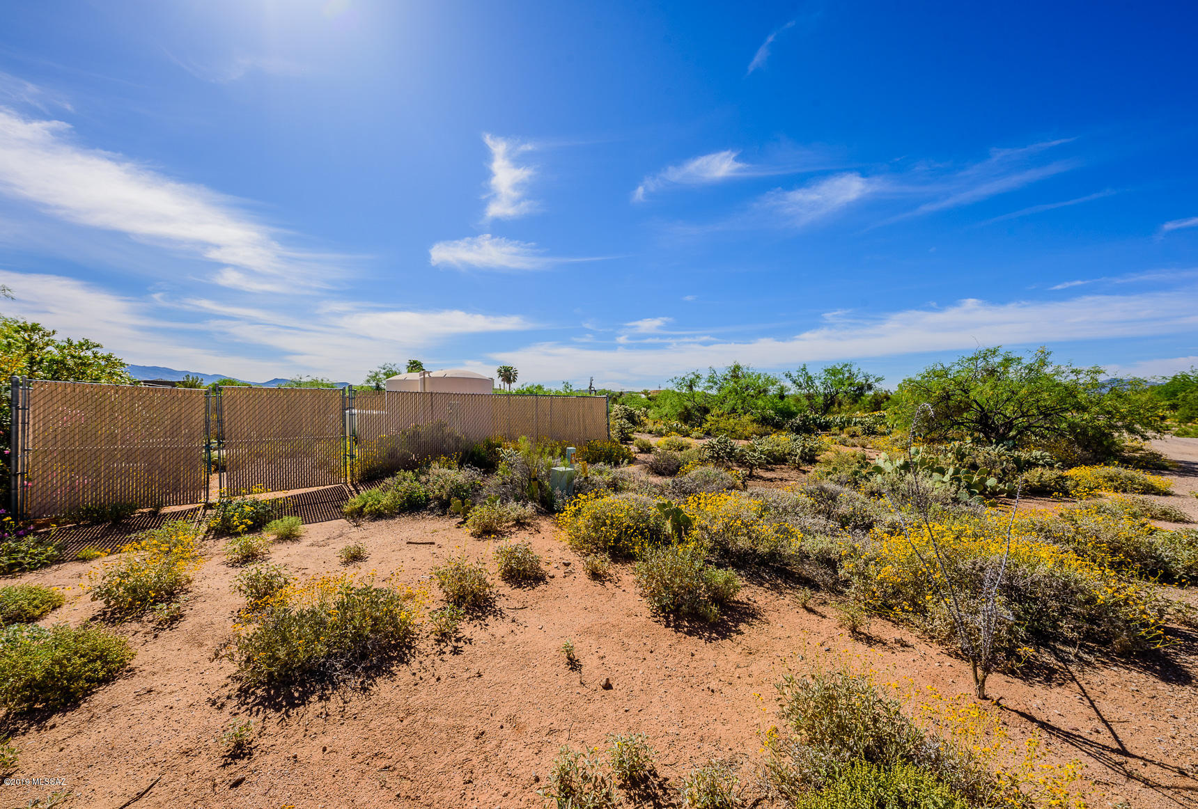 This is the place for your custom built dream home in Vail! This 2 acre lot is dividable
if you feel like sharing or keep all that space to yourself, your family and your pets. Horses allowed but manufactured homes are not. The shared well is at the lot corner and electric is in the road. Enjoy the natural desert and Rincon Mountain views on this mostly flat lot. Only about 500' from the paved road and this road ends just a few houses down so little traffic and shared maintenance. Come take a look at this quiet piece of land and make it your own oasis in the desert!