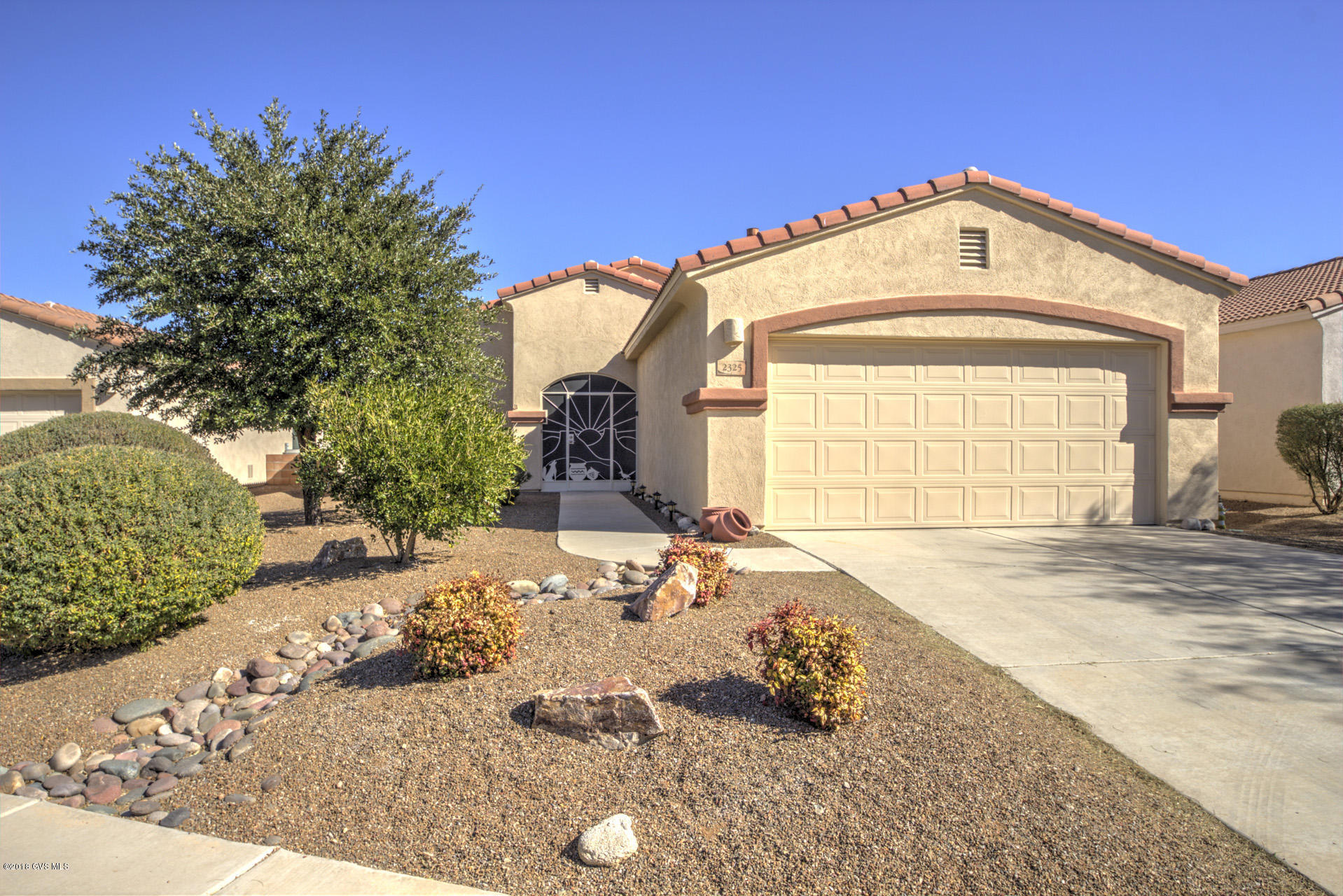 WOW! View the Santa Rita mountains from the privacy of your LR/DR, kitchen and master BR or from the private back patio. Morning, noon, night the view will delight you! An EXTREMELY well maintained single family home in The Legends - from the gorgeous MTN view to the all tile floors to the extended (4ft) garage to the Solar System (all paid for!) - this home has it all and is ready for you to enjoy! Featuring 2 BR's plus den - very livable! All tile flooring makes for easy care. The solar panels allow the electric billing to be very low - averages about $15 p/m! Water heater & circulating control new in Dec. 2017. Water softener replaced in 2016. Some of the furniture can be purchased on a SBOS - making for a quick move in. It has been said before, but this is truly a must see home!