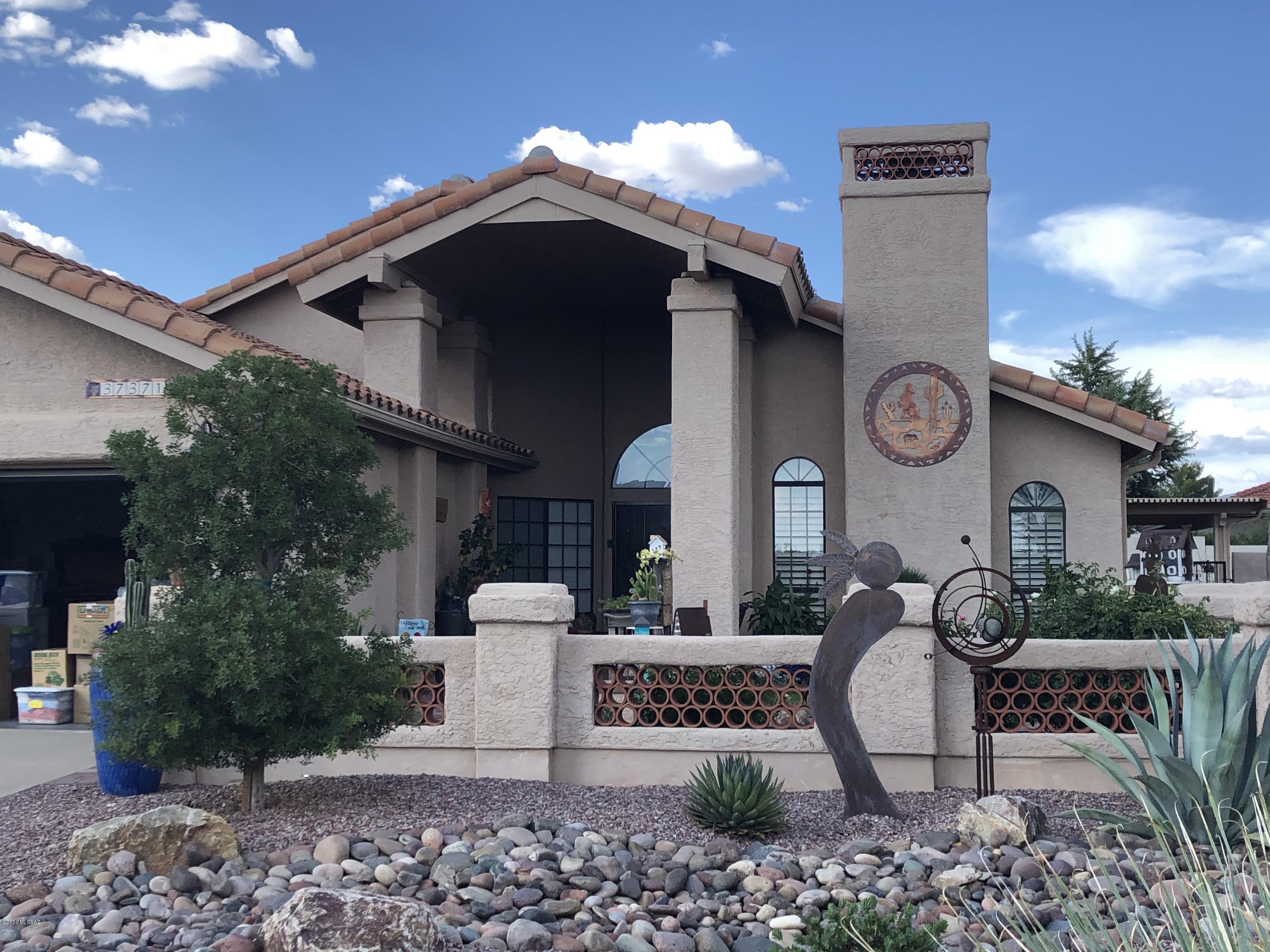 Panoramic Mountain Views. Amazing 2019 Posada Remodel with Chef's Kitchen, New Cabinets, Granite, Expanded Island, SS Appliances & Bay Windows. 20'' tile on the Diagonal, Skylights throughout and Spacious LR/DR area with Mtn Views, Plantation Shutters & Stone Fireplace. Enjoy the Covered Back Patio w/Pavers, Outdoor Kitchen, Fire Pit, Low-Care Pool/Spa/Waterfall surrounded Kool Deck. Expansive Master Ste w/Sitting Rm, Sliders to Patio & Luxurious Master Bath. Casita added in 2019 for Guests to Enjoy. Park-Like Backyard w/Shade Trees & Mature Landscaping in Saddlebrooke, Tucson's #1 Active Adult Comm. w/Golf, Pickleball, Tennis and 168 Clubs to join!  Home is walking distance to HOA1 clubhouse too.