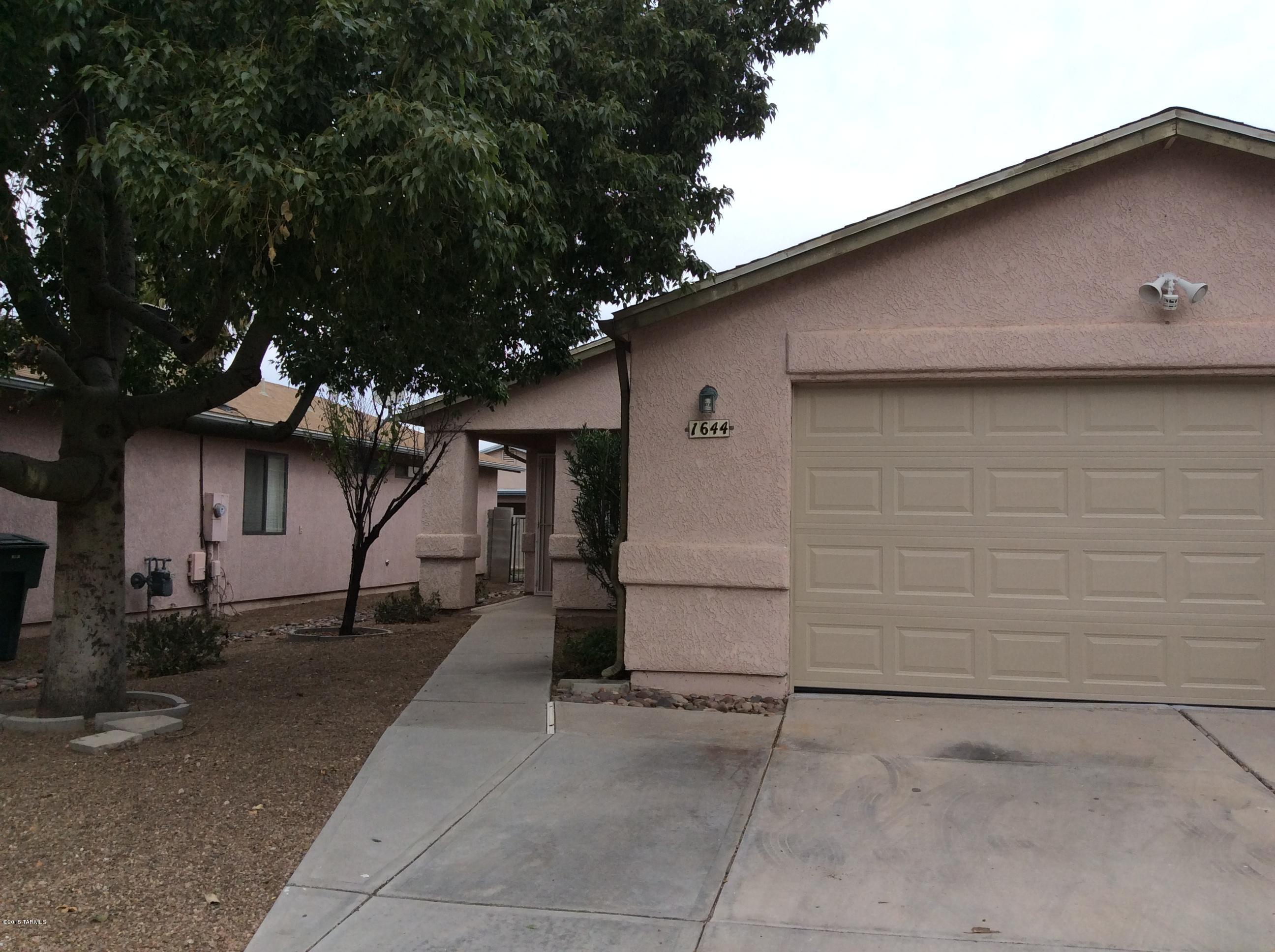 Beautiful 3BD/2Ba home.  Ceramic tile throughout. Fresh paint throughout.  Split bedroom plan.  Enter into front door to large open great room, open to kitchen and dining area.  Large laundry room with storage.  Great backyard with raised planters with rose bushes.  Extended covered patio.  This home is ready for move-in Feb 1.  Dont miss out on this one call for a viewing today.