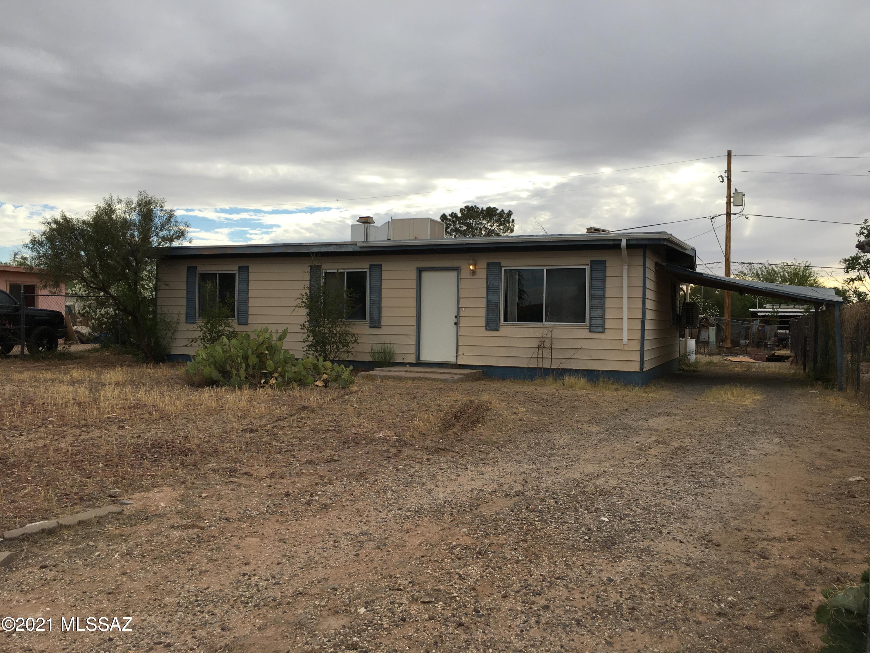 Fix up with massive potential! This home needs TLC but has three bedrooms 1 bathroom, and a carport. HVAC Minisplits are newer - 1 year in age. Large fenced front and back yards.  1 block from THE LOOP, Craycroft Elementary and a park.  NO HOA. Plenty of room for RV or toys. Easy access to freeway and shopping/entertainment.  Great opportunity! Cash buyers only.  Home sold AS IS no repairs. Hurry!