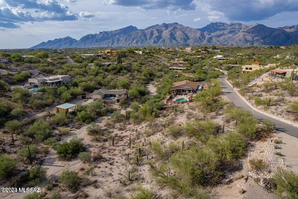 Land costs (land sale price)
Site Development estimate: $80,000 *estimate
Pike base price (spanish Elevation) $494,499 (*base price subject to change)
Discover your desert oasis in La Buena Vida Estates. Subdivided lot ready for your custom home. Utilities to the lot line. Serene mountain/city views, and wildlife ambiance. Proximity to schools, shops, Sabino Canyon, UofA and downtown. Elevate your lifestyle - seize this opportunity now!