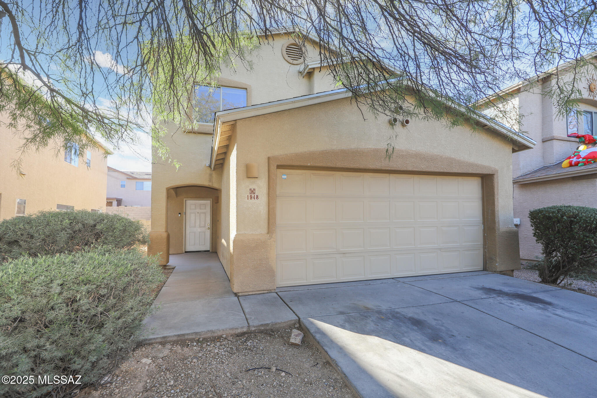 Move-in ready 4 bed, 3 bath home with a den featuring french doors and an upstairs bonus area. Two-story floor plan with 1,865 sq ft of living space, has a great room and kitchen with breakfast bar. The primary bedroom includes a large walk-in closet and primary shower. Enjoy a low maintenance backyard with flower beds, a garden area, and a sitting area. Updates include a new AC unit installed in 2022 and a new water heater installed in 2023. Offering peace of mind and energy efficiency. Conveniently located near the I-10 freeway, Costco, restaurants, shopping, Banner Hospital is nearby and only 15 minutes to the University of Arizona. Perfectly situated for easy commuting around Tucson. Two-story homes rarely come up for sale in this area! Don't miss this opportunity.