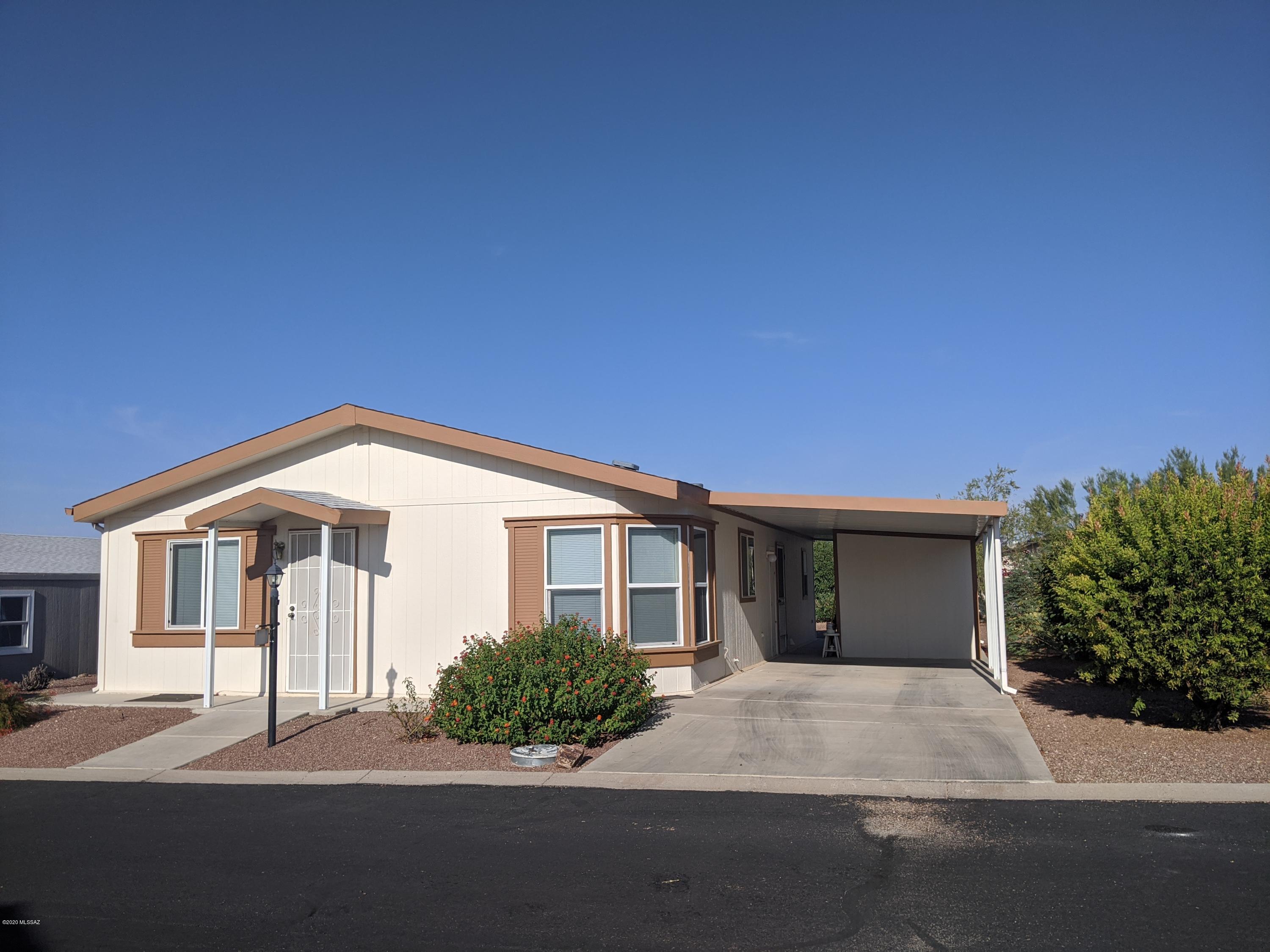 This 2004 Hallmark home is situated on a quiet street with a beautiful mountain view as you approach the home. A open living space includes a large owners suite with huge closet, oak kitchen cabinets, pantry, gas stove and extra storage! Roof replaced in 2016, HVAC in 2015, newer water heater and exterior paint. Move in ready! This home will not last. Copper Crest is a 55+ active adult gated community located just west of the Tucson Mountains and 15 minutes from downtown. Amenities included: Jr. Olympic-sized pool, Spa, Bocci Ball, Shuffleboard, hiking trails and hiking club. INDOOR activities include: workout room, pool/billiards room, rec center for group activities and library. Low HOA!