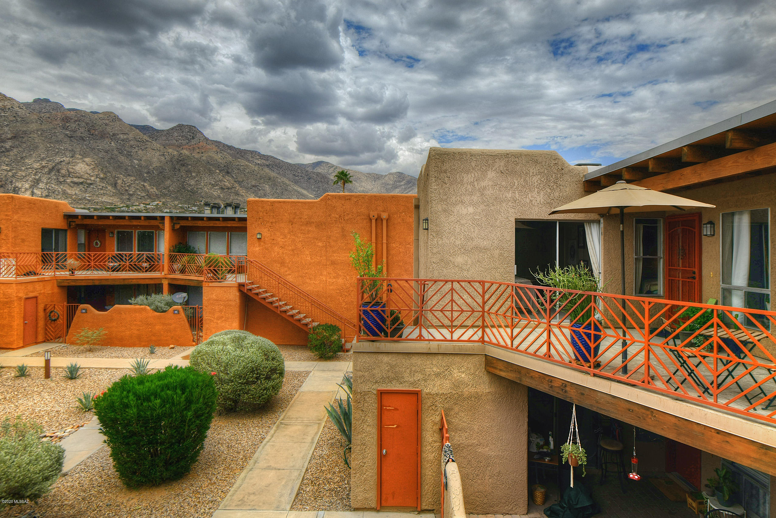 You will LOVE this Contemporary Condo with sweeping Catalina Mountain Views & a large covered patio/balcony to enjoy.  This is a 2 bedroom/1 bath, with fireplace, sweet kitchen- refrigerator, washer/dryer, dishwasher, oven/stove, lots of storage & light throughout the unit, skylights, ceiling fans and that balcony with ample room to enjoy.  Unit comes with additional storage closet  & 1 covered parking space. The amenities in the Reflections of the Catalina's complex are many; Pool (heated in winter) & a stunning view of the mountains, a spa, workout facilities, outdoor grill for entertaining friends. This could be your home away from home to enjoy winters or a full time residence.  Location is key- close to hiking, cycling, restaurants & grocery... Come take a look!