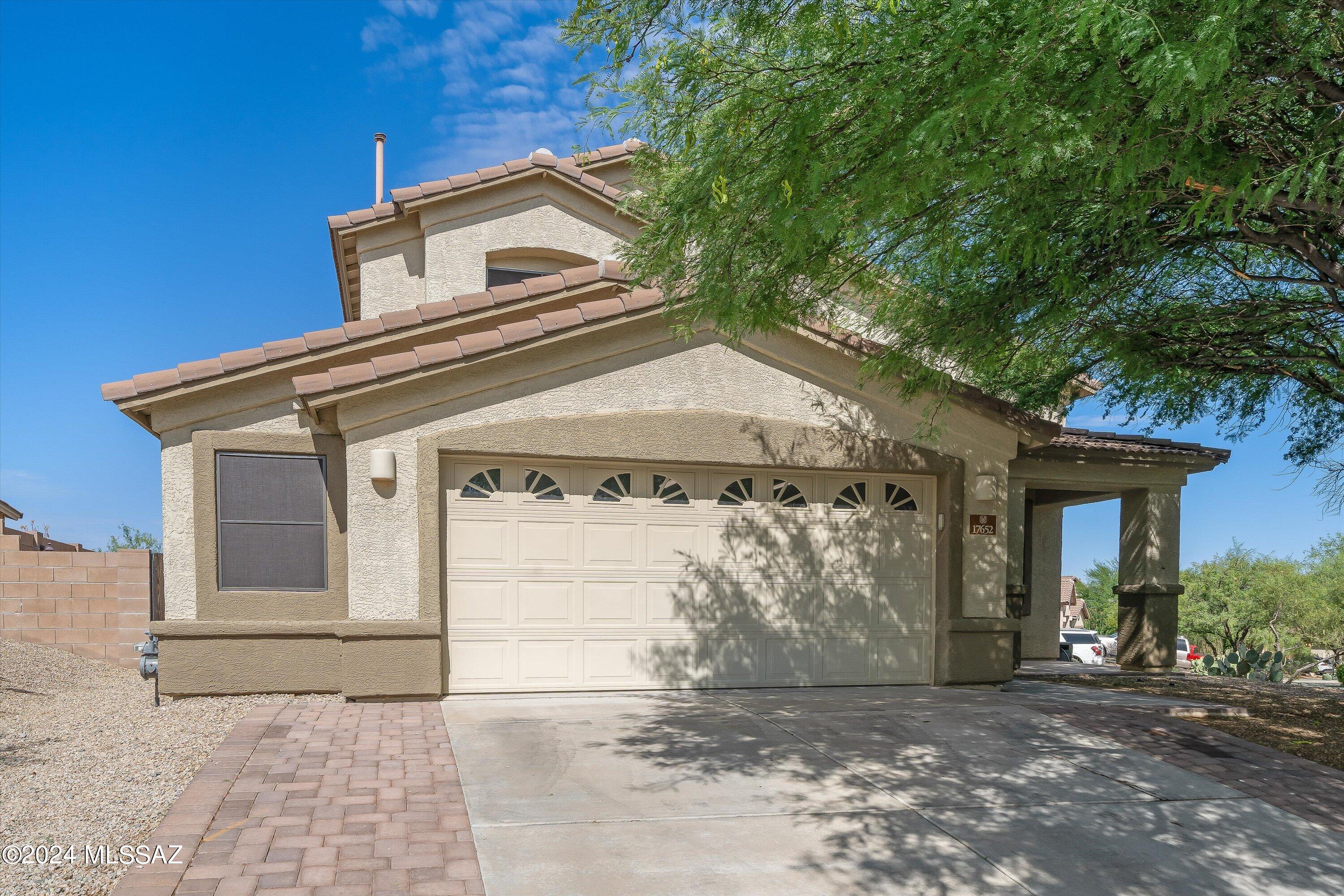 Introducing this spacious house that spans 2,289 square feet and boasts 4 bedrooms and 3 bathrooms on a corner lot. It provides plenty of comfortable living with an inviting backyard and extra storage space in the garage. Whether you're in the large soaking tub in the primary suite or in the hot tub in the relaxing backyard featuring a real grass lawn, orange tree, oleanders, and irrigation set for any other vegetation you choose, you're sure to relax and unwind. Whether you are looking to host gatherings, soak in the beautiful views or watch the vermillion sunsets, this property offers a blend of comfort in a highly desirable location and the award winning Vail School District. Welcome to your new dream home.