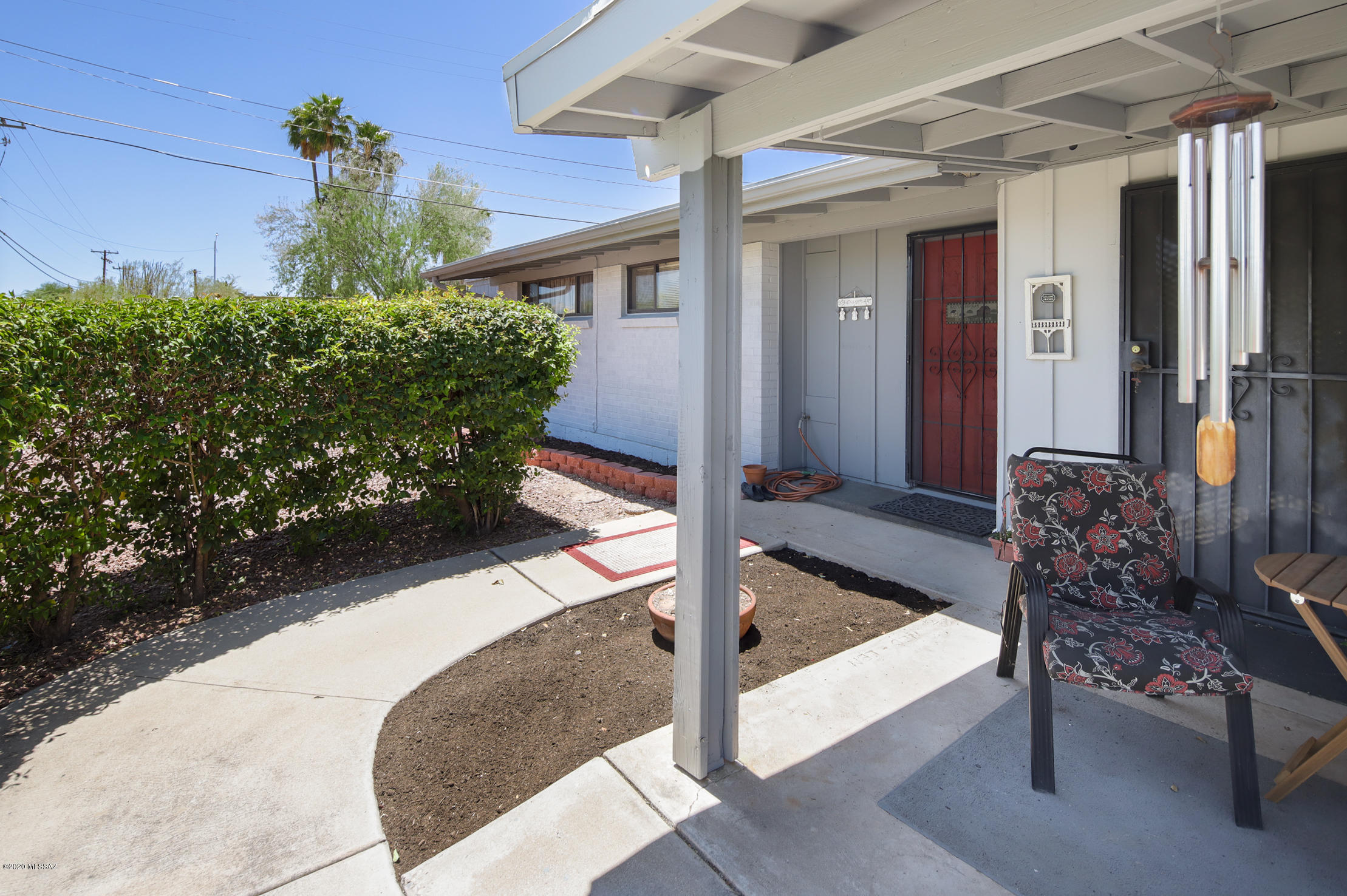 Well Built and lovingly maintained home since 1999 by this family, 3/2 plus separate studio or 4th bedroom off laundry with separate entrance. Large living room with add on den with FP overlooking nice backyard with mature vegetation, pool and alley access with double gate to yard which is surrounded by masonry wall. Plumbing completely redone including to pool, newer a/c and roof maintenance. Elevated lot above street adds to the privacy.