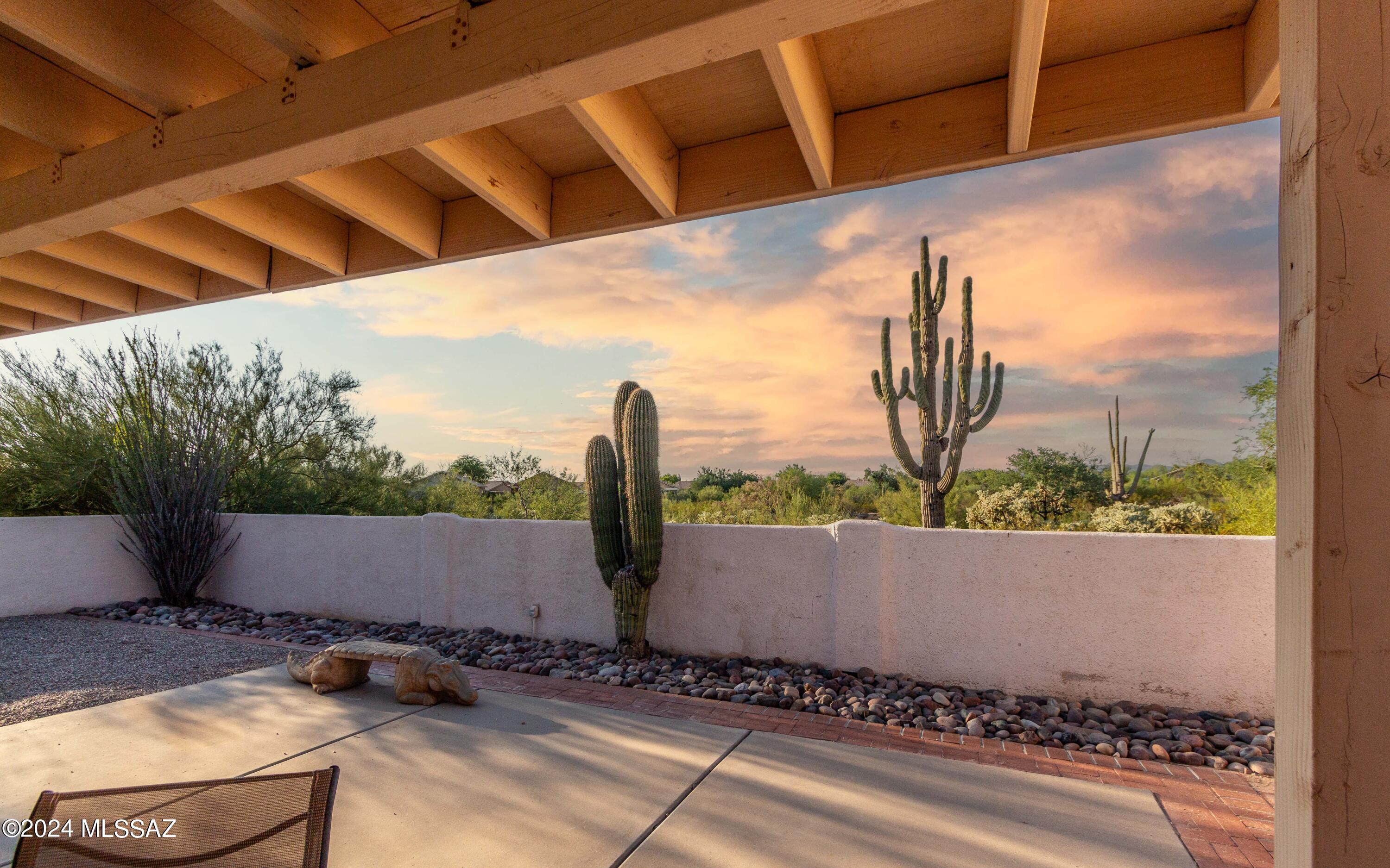 With an accepted offer seller will buy down the buyers rate at COE. Discover your desert oasis in northwest Tucson! This well-maintained home offers stunning desert views from the back patio, perfect for taking in our serene sunsets. Enjoy peace of mind with no polybutylene pipes, roof replaced in 2016, and freshly painted exterior. Inside, find beautiful wood floors, fresh carpet, split bedroom floor plan, and several new windows. The updated kitchen features sleek quartz countertops and an undermount sink. Located in a charming neighborhood with not one but TWO community pools, this home combines comfort and convenience with easy access to shopping at Arizona Pavilions and Tucson Premium Outlets. Don't miss out on this gem!