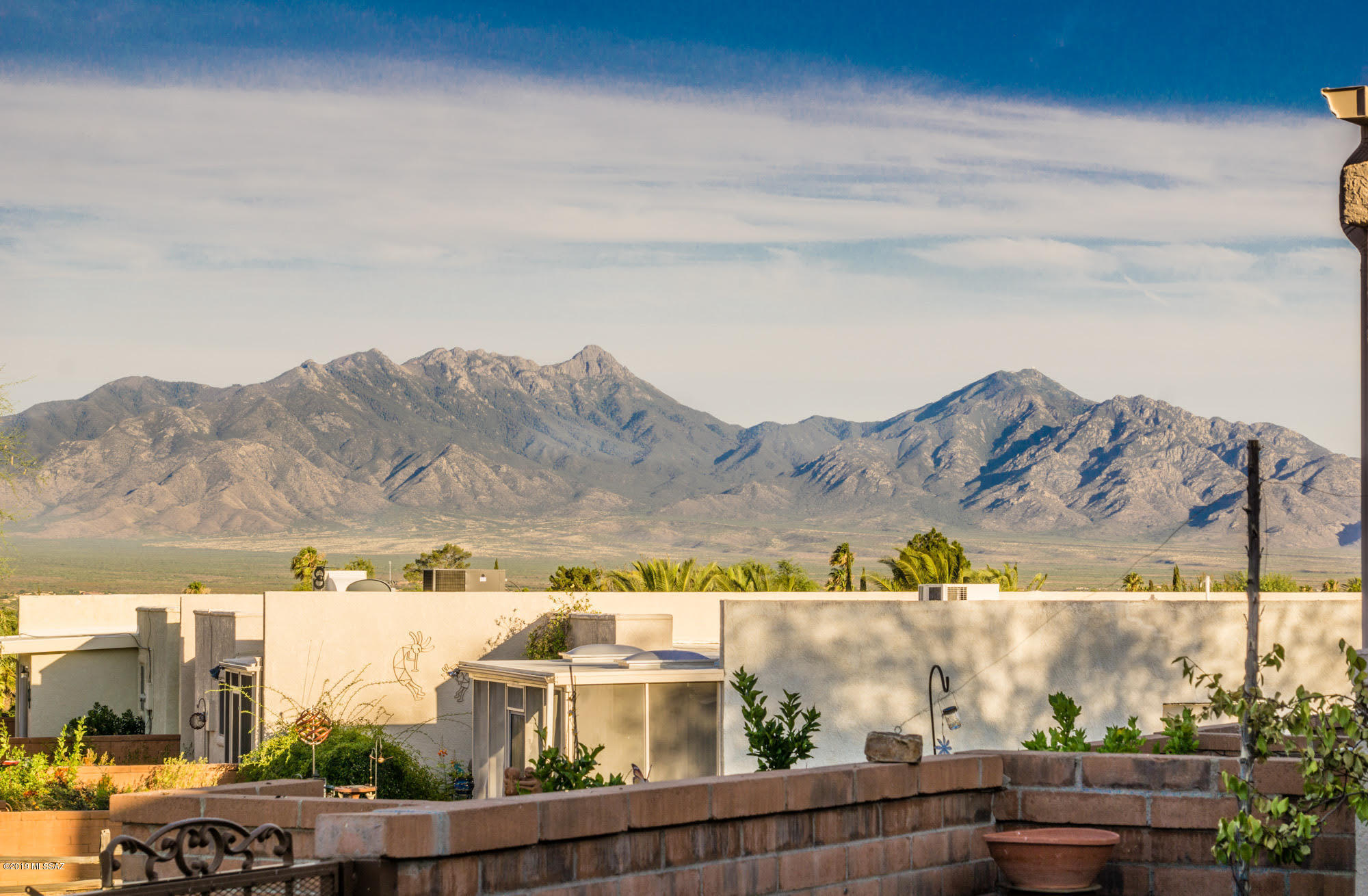 Stunning & impeccably maintained Dorn townhome w/ the incredible Santa Rita views everyone loves! Soaring ceilings, clerestory windows, skylights & rich paint accents create a beautiful, warm atmosphere. Gorgeous Saltillo tile in traffic areas, newer carpet in bedrooms & den. HVAC new in 2018. Kitchen features updated appliances & counter-top finish, w/ arched opening pass-thru to dining area. Cozy eat-in breakfast nook, & large pantry. Open concept dining to living rm - relax by the incredible corner gas fireplace that completes the ambiance of this space. Spacious master w/ slider to back patio. Master bath w/ spa tub & separate shower. Den makes a perfect office or t.v. room. Private guest rm adjacent to full bath. Step out to back patio & soak up those Santa Rita views. Simply perfect! Some of the recent updates include: New HVAC in 2018. New kitchen sink, microwave, dishwasher, fridge & blinds. Artistic finish on kitchen counters. Newer carpet in BR's & den. Back irrigation system updated. Sun protection window covering. Hot water circulating pump. 
List of furniture available by separate bill of sale.