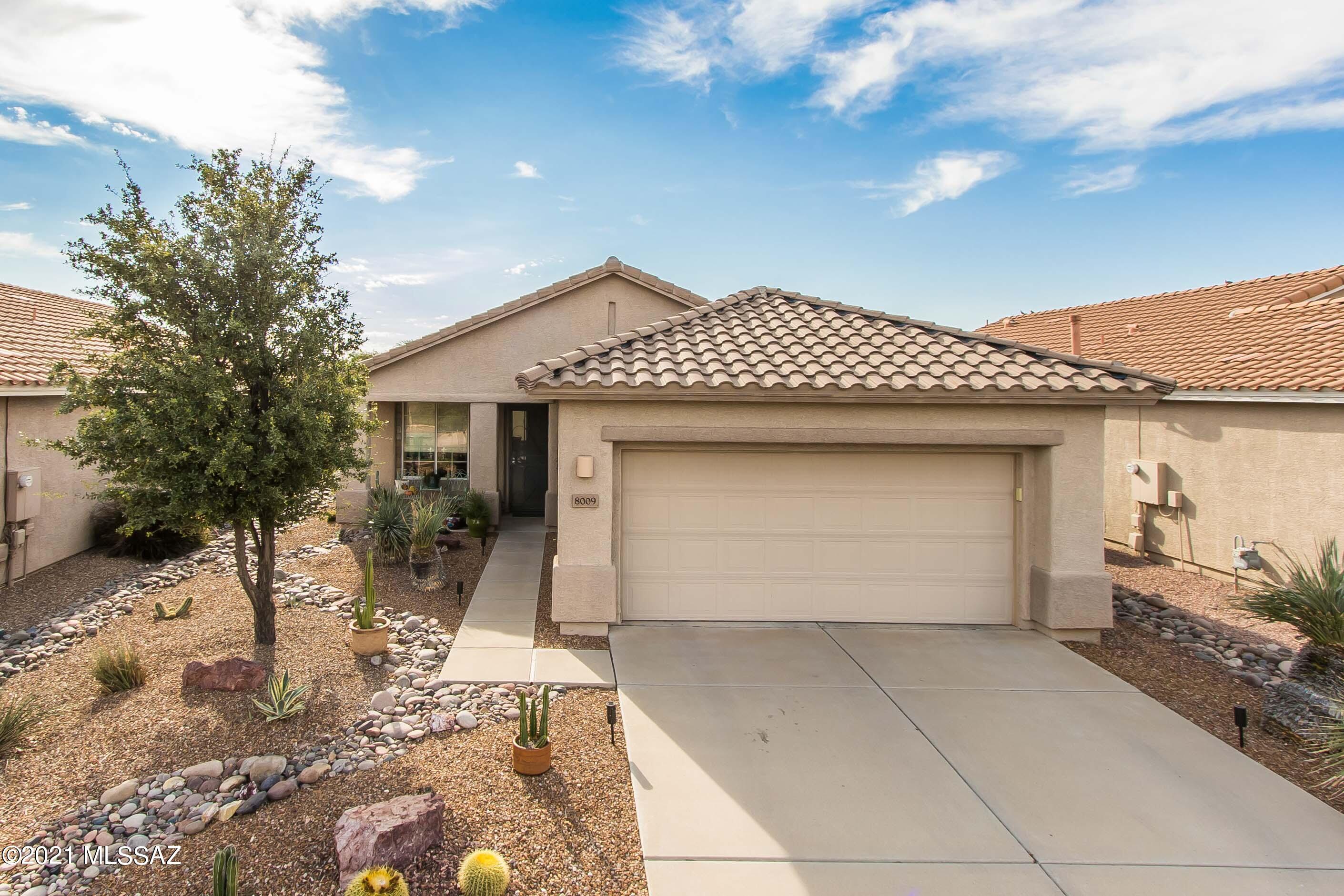 This home in Sunflower's over 55 community will delight you!  New paint, flooring, and fixtures in this turn key home. Mature orange, lime, and a lemon tree in the backyard offers you everything there is to love about Tucson living!  Sellers have added overhead storage in the garage, water softener, and fenced in the yard.  You will be saying ''Wow'' when you walk into this home.