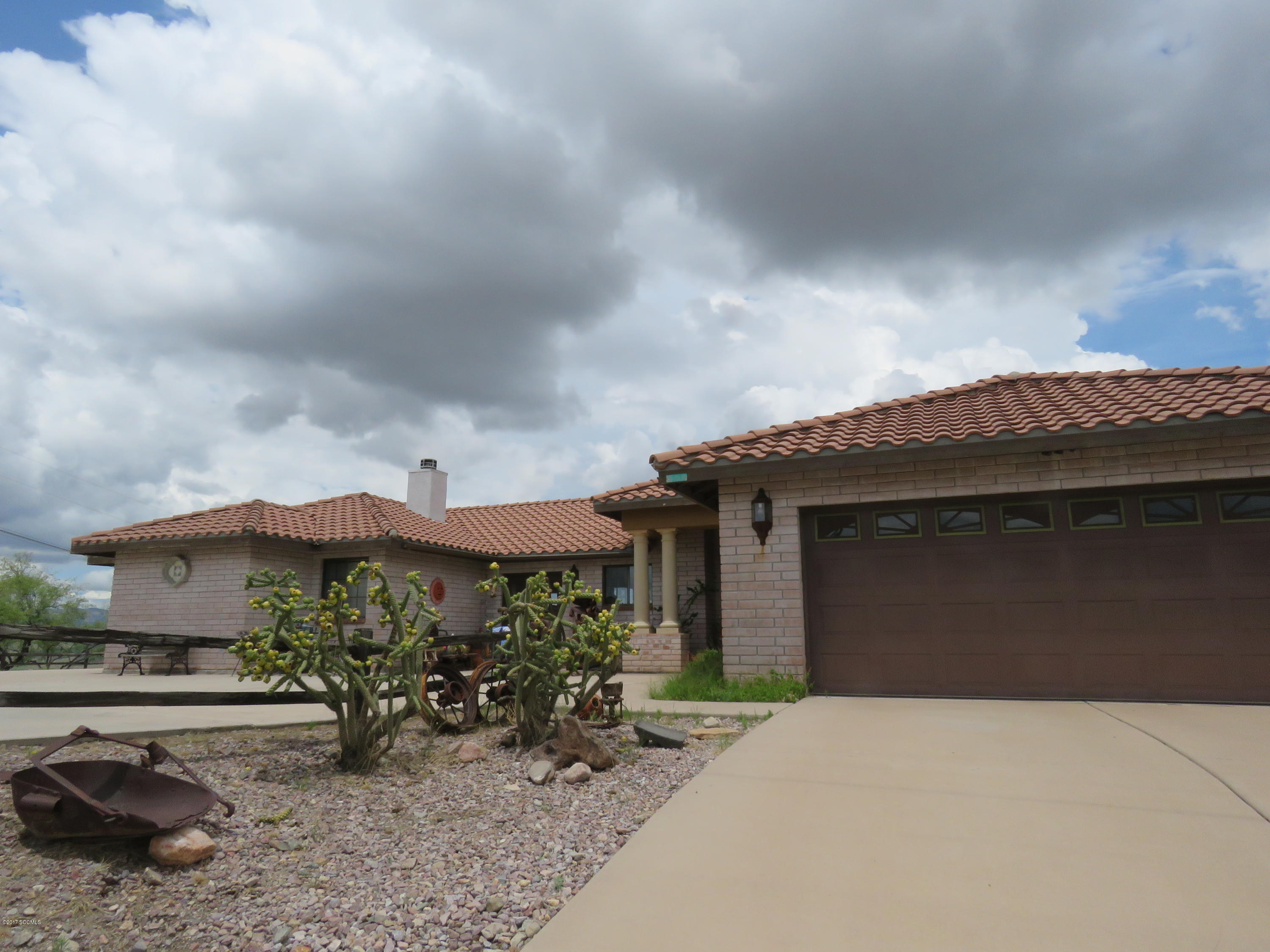 Don't Miss this beautiful custom built home with saltillo tile throughout with 360 degree views, very private, vaulted ceilings, large patio front and full length patio in back. All bedrooms have walk in closets, fireplace in master bedroom, Jacuzzi in master bath, fireplace in TV room with beautiful picture window in living room. A Must See!