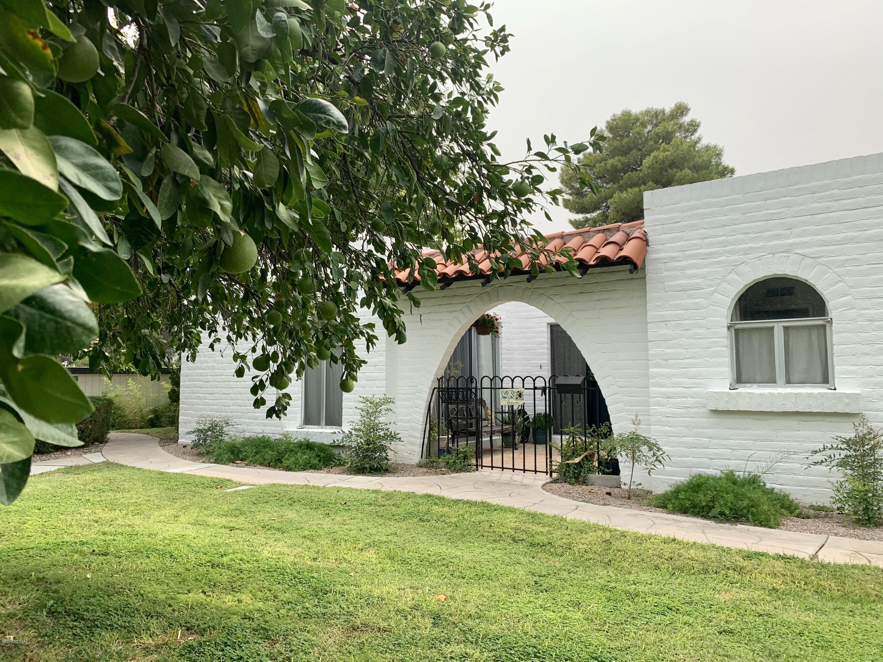 LIGHT,BRIGHT & CHEERFUL BURNT ADOBE CONDO IN CASITAS DE CASTILIAN, AN OVER 55 COMMUNITY DESIGNED BY RENOWNED ARCHITECT BENNIE GONZALES.  HM BOASTS A COZY GAS BEEHIVE FIREPLACE, REMODELED KITCHEN W/ KRAFTMAID SOFT CLOSE CABINETS & CORIAN COUNTERS, SS APPLIANCES, WATER SOFTENER/ REVERSE OSMOSIS, NEW HVAC & WATER HEATER, UPGRADED 220 AMP SERVICE,  TRAVERTINE FLOORING & NEW CARPET IN BEDROOMS, UPDATED BATHS PLUS PRIVATE FRONT & BACK PATIOS W/ CLASSIC OLD PAVERS.  ONE OF THE BEST LOTS IN THE COMMUNITY, SURROUNDED BY 17 ACRES OF LUSH GROUNDS SO CLOSE TO CARPORT & HEATED COMMUNITY POOL. CASITAS ARE IN CONVENIENT ROLLER COASTER/ ORACLE AREA NORTH OF TUCSON MALL, CLOSE TO RESTAURANTS & BUS LINES. HOA FEE COVERS WATER, GARBAGE, 2 POOLS, TENNIS, CLUBHOUSE, MAINTENANCE/ PAINTING OF BUILDINGS & GROUNDS