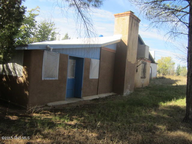 Diamond in the Rough on a a large 10 acre lot! Pond in front. Shed on property.