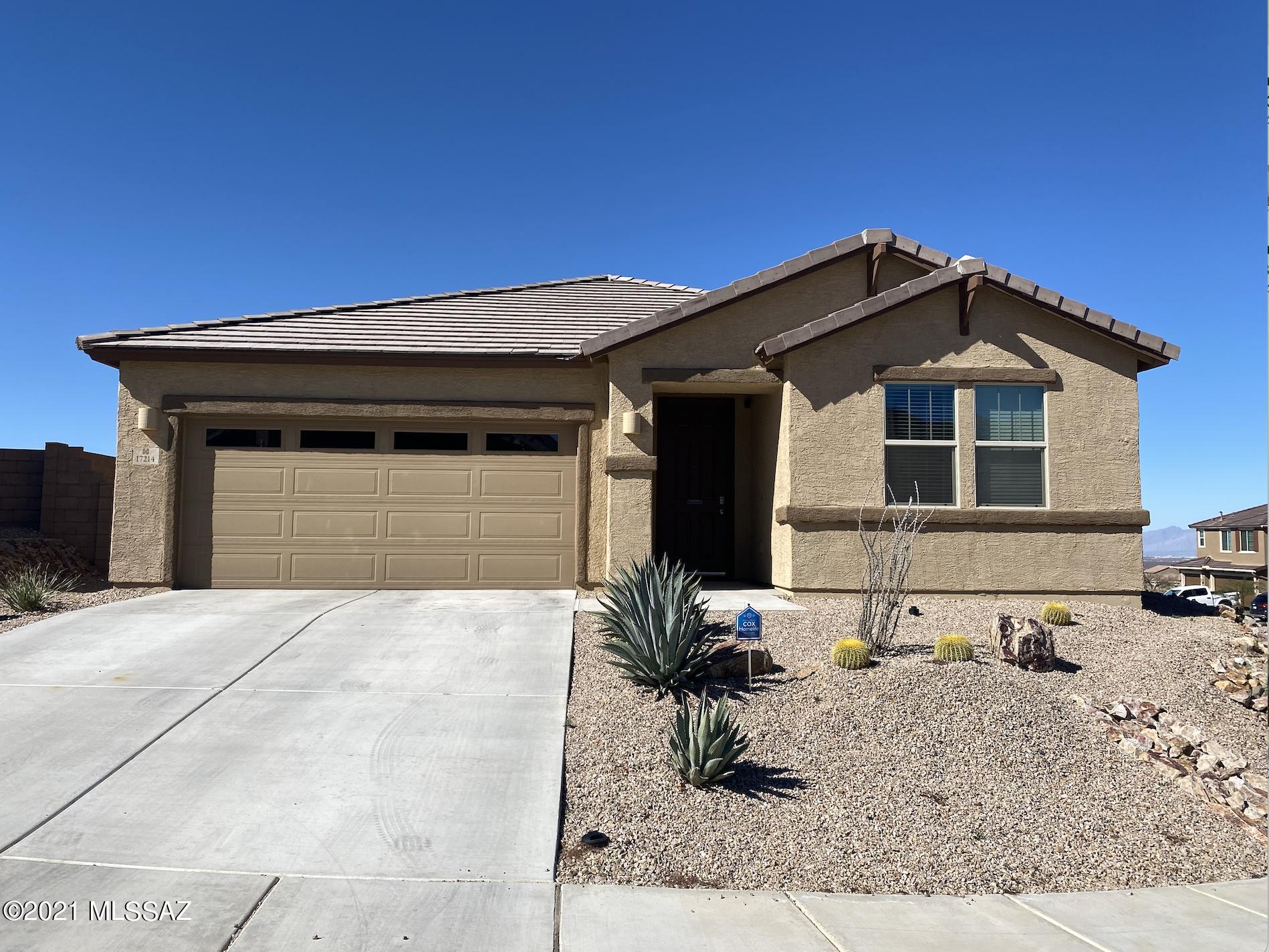 Located in the highly desirable and family friendly Santa Rita Ranch community and Vail School District. Built in 2018. This beautiful 4 bed 3 bath, is perfect to gather with friends and family in the expansive great room, dining room and kitchen with a large center island, white cabinets, quartz countertops and stainless steel appliances! From living room area, the double sliding patio doors lead to an extended covered patio and backyard for additional outdoor living space with only one neighbor! Lots of privacy and mountain views! This home also includes another master bedroom with its own bathroom. Plus 2 bedrooms and hall bath with a shower and a tub. The Master suite has a large walk-in closet and a beautiful bathroom with double sinks, oversized walk-in shower.