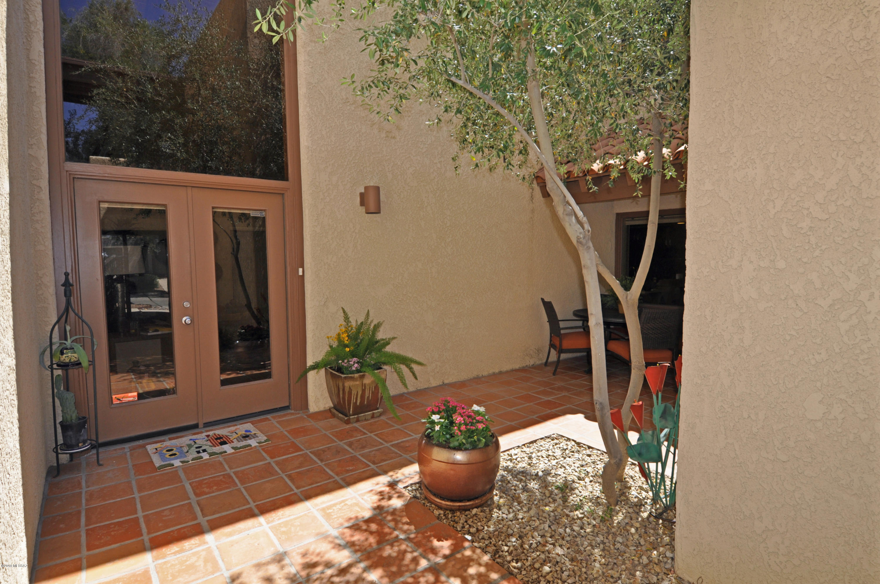 The Epic Urban Architecture you've been waiting for! End residence in a lush subdivision of 4 custom townhomes. Thick, mature trees shade everything! Gated front courtyard leads to a unique front door and seating area. Soaring beamed, tongue & groove ceilings, double sided fireplace. 3 Master Suites! Renewed & Updated since 2013: New roof, new water heater, new central air units. Elegant, porcelain wood tile floors. Complete re-design of the kitchen which now features Quartz counters, full complement of luxury SS appliances, new cabinetry. Bath remodeling includes walk-in showers, relaxing soaking tub. Unique 2nd story porches & decks - 2 glass enclosed & 1 open air. Lovely yard & garden with 7ft wall, oversized covered patio. Full Laundry rm. Community pool is steps from your front door.