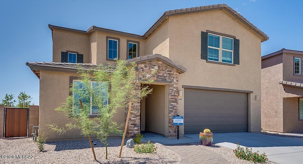 QMI - Madera B, 4 BR with Pocket Office off kit, Foyer opens into Dining area and open concept Great Room and kitchen with walk in pantry. Upgraded LUX Floor Package, tile floors throughout the home, carpet only in bedrooms. Upgraded cabinets are Scottsdale Chery Java, Granite is Capri Gray. 3 bay tandem garage. Covered patio, Commercial grade network, Schlage Smart Wi-Fi Deadbolt, Honeywell Smart Thermostat, Ring Video Doorbell Pro, Ruckus Wireless ZoneFlex R510, radiant barrier roof sheathing, Energy-efficient LED lighting, Insulated air ducts, Dual-pane low-E vinyl framed windows, 14 SEER energy-efficient HVAC system, 9' ceilings, two side gates, faux wood blinds on select windows and so much more!