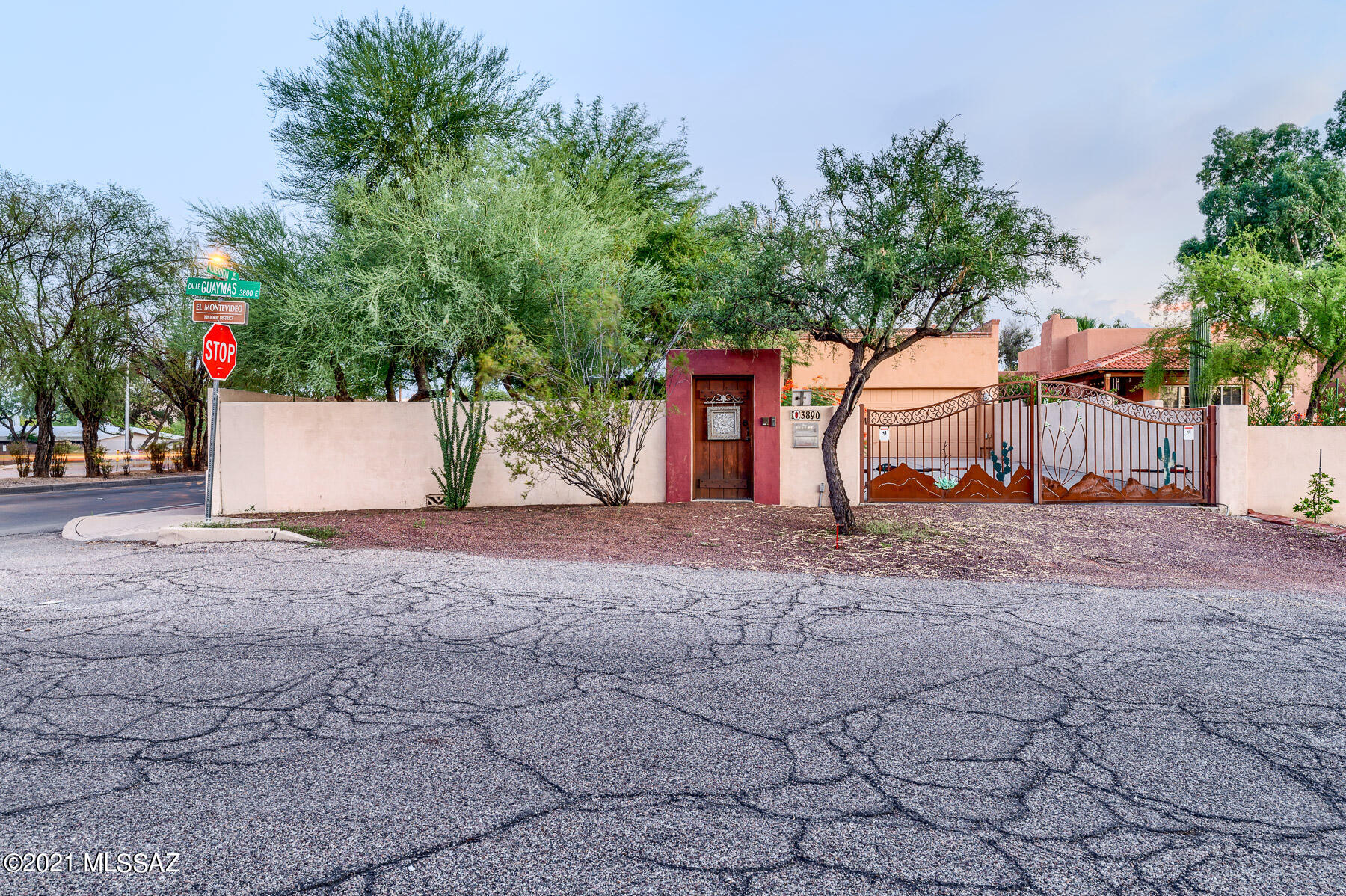 This beautiful 3 bed 3 bath home is located in the historic El Montevideo neighborhood near Reid Park, shopping, restaurants, the U of A and much more. With an open floor plan that offers a well lit open eat-in kitchen with granite counters and breakfast bar. This space is well complimented with a large dining room and oversized great room with a cozy fireplace. The large covered patio with custom outdoor BBQ and bar is a perfect private area to entertain family & friends. The entire estate is surrounded by a decorated masonry stucco wall with an electric gated entry.