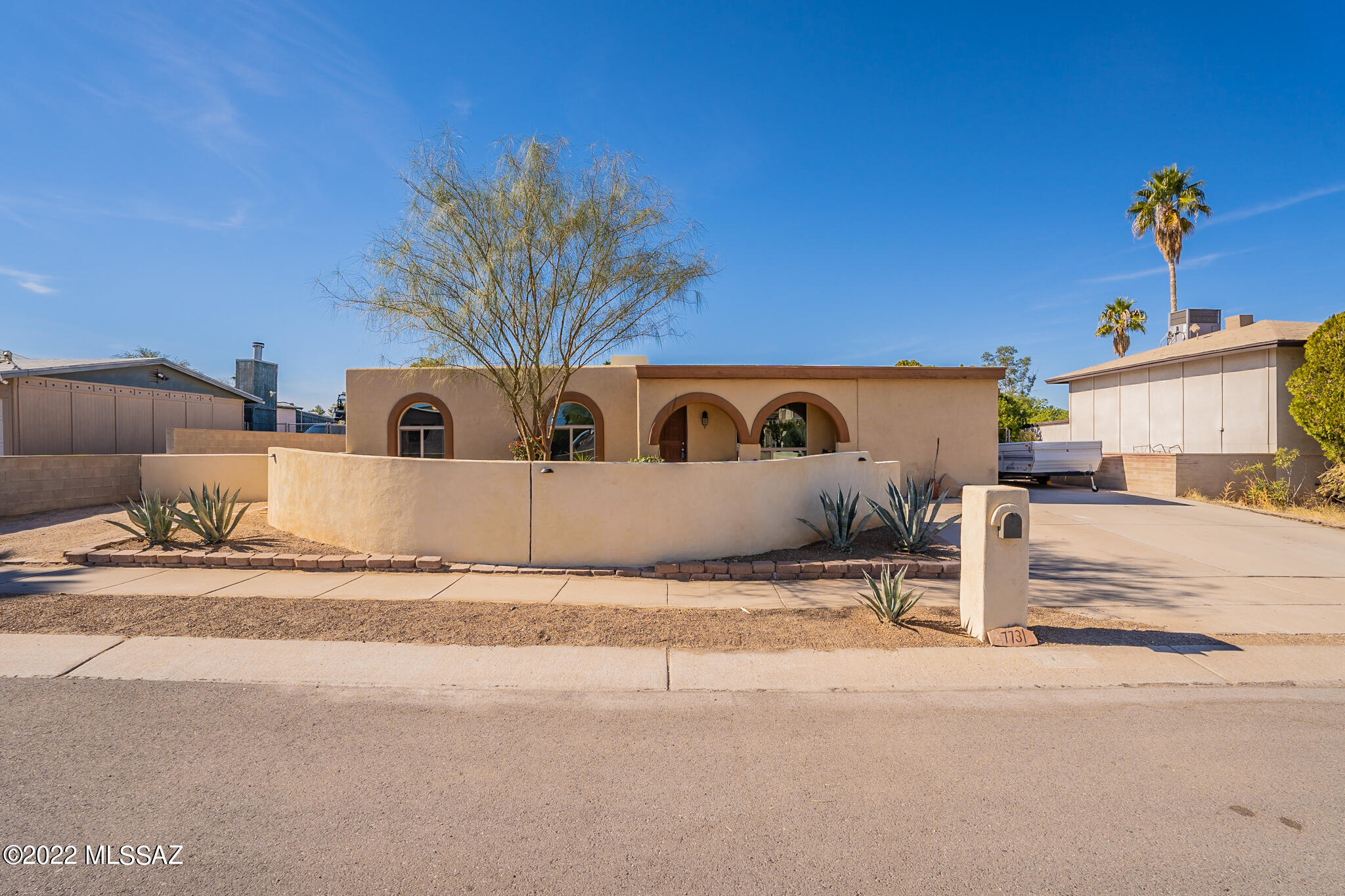 Nicely updated move-in ready home on huge lot in popular NW location near everything! Light & bright with saltillo & newer wood floors throughout. Versatile floor plan with spacious living room, formal dining & large family room. Open kitchen with lots of nice cabinetry, granite countertops & convenient breakfast bar. Additional bonus room that could easily be media area or office. Oversized master suite with two closets, sitting area & updated bath with custom tiled walk-in shower. Huge lot with extended covered back patio, extra storage shed & tandem 2 1/2 car garage. Plenty of room for Rv or extra toys! Home was replumbed 2 years ago & water heater is only 3 years old. No Hoa & walking distance to elementary school, restaurants & more!