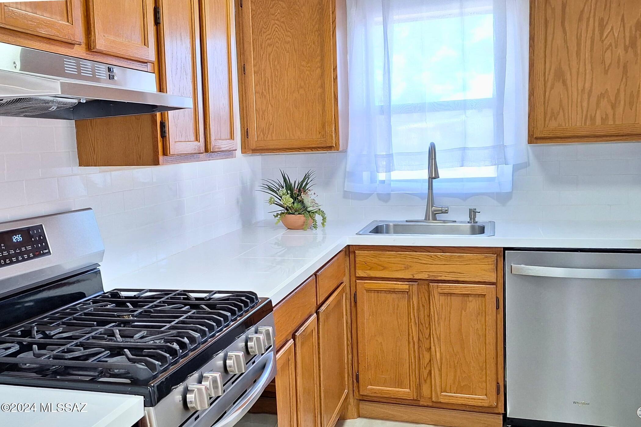 Fresh paint, new tile, so much character! This charming 2 bedroom/2 bath home is centrally located only one block away from Shopping and Dining, Reid Park, the Golf Course and the David Bell Exercise Path. An additional flex room leads out to the spacious fenced-in backyard, which offers ample room for cultivating a garden or simply enjoying the pleasant springtime weather. Enjoy the quiet neighborhood from the comfort of the covered front porch or relax in the expansive covered back patio.  Call or text to schedule a showing appointment. One year lease.  One owner is a licensed real estate agent in the state of Arizona.