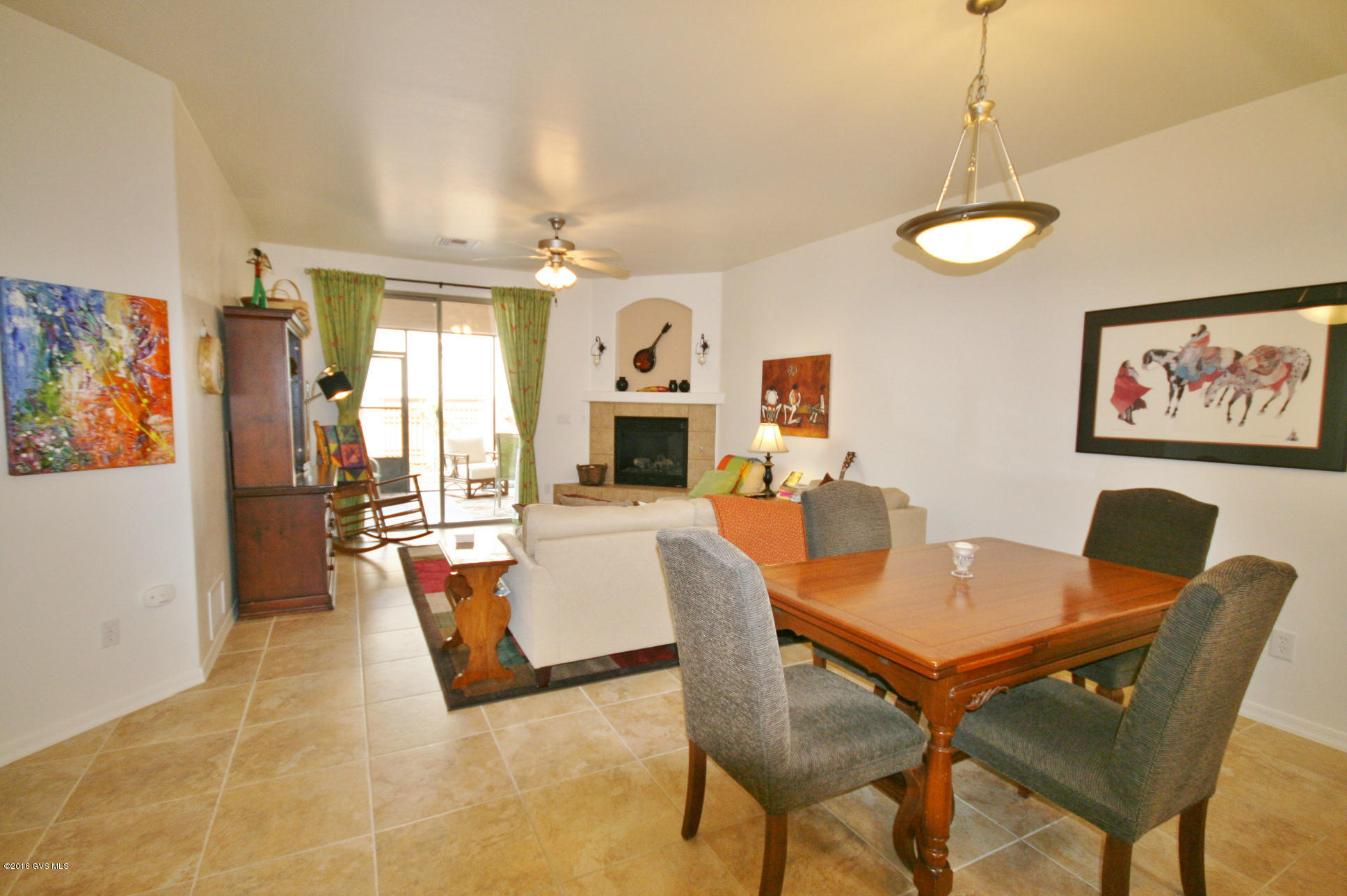 RELAX & ENJOY THIS EASY-CARE RETREAT! Whether cozying by the gas-log fireplace on a winter's eve or in the screened-in porch in the summer's shade, you'll love its high ceilings, all kitchen appliances, neutral paint & TILE throughout. If you need a workbench or storage for bikes, ATVs or golf cart, the extra roomy garage with epoxy floors is perfect. Canyon View's beautiful clubhouse has a pool, spa, games, media & library. Optional Green Valley Rec is available if you decide to join. It offers 13 more rec centers and 1000s of classes in art, ceramics, sports, dance, music, photography, silver & jewelry making, woodworking, computers, games, nature studies, hikes & more. Here you can keep growing, not get get old. How active you want to be is YOUR CHOICE.
