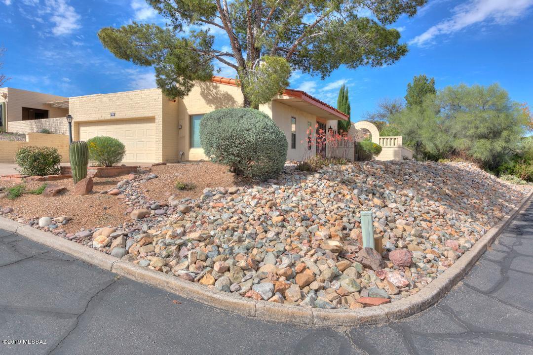 Free standing townhouse with nice views from patio. Big storage room off back patio, Private back patio with tile and screened in. Views from large side yard. Large laundry room for lots of storage. Dining room, and eat in kitchen. Beehive fireplace in living room. HVAC replaced a few years ago. Lots of closets and storage. Very private setting.